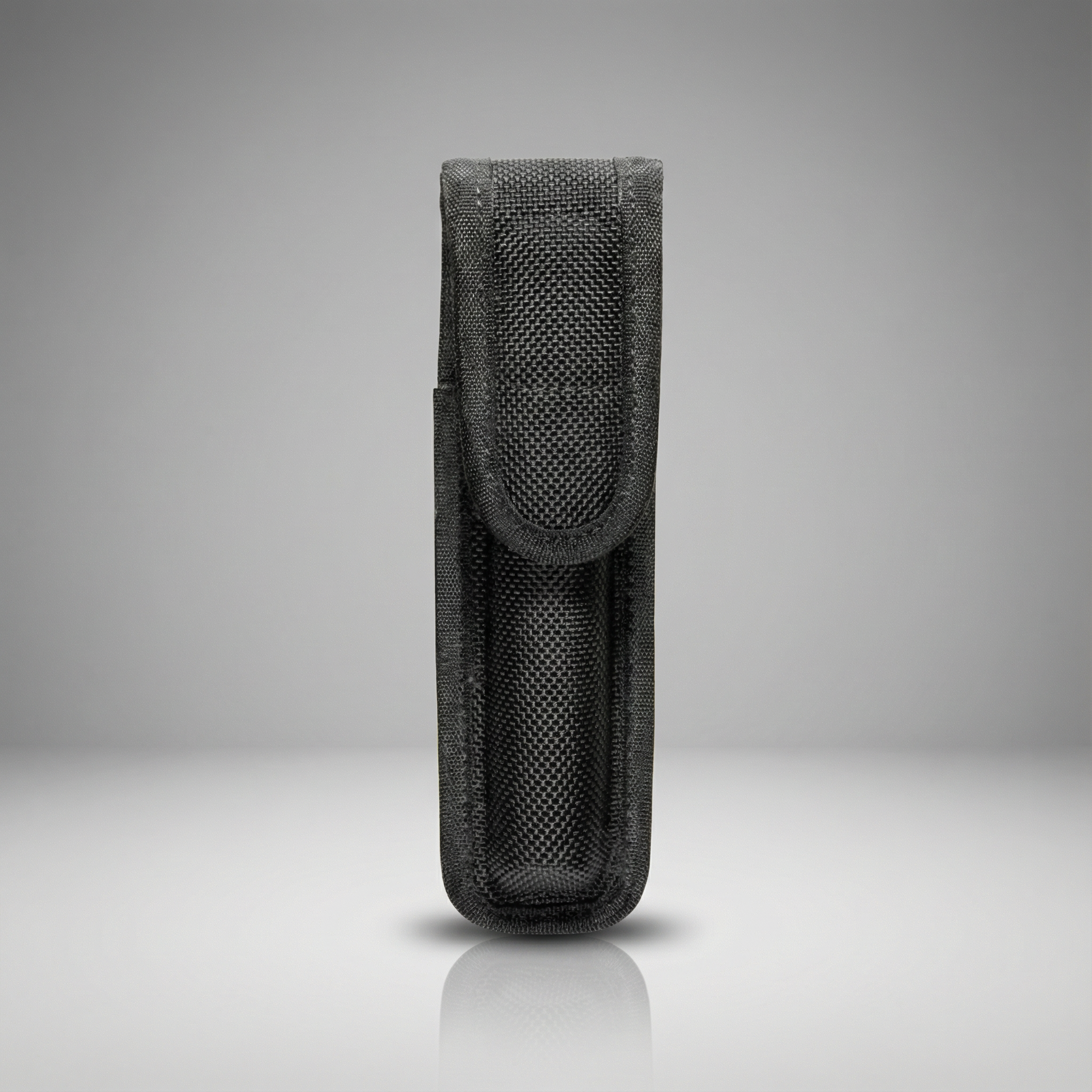 Bianchi Model 7310 Mini-Light Holder AA flashlight belt holster 7310 in black AccuMold on a gray background