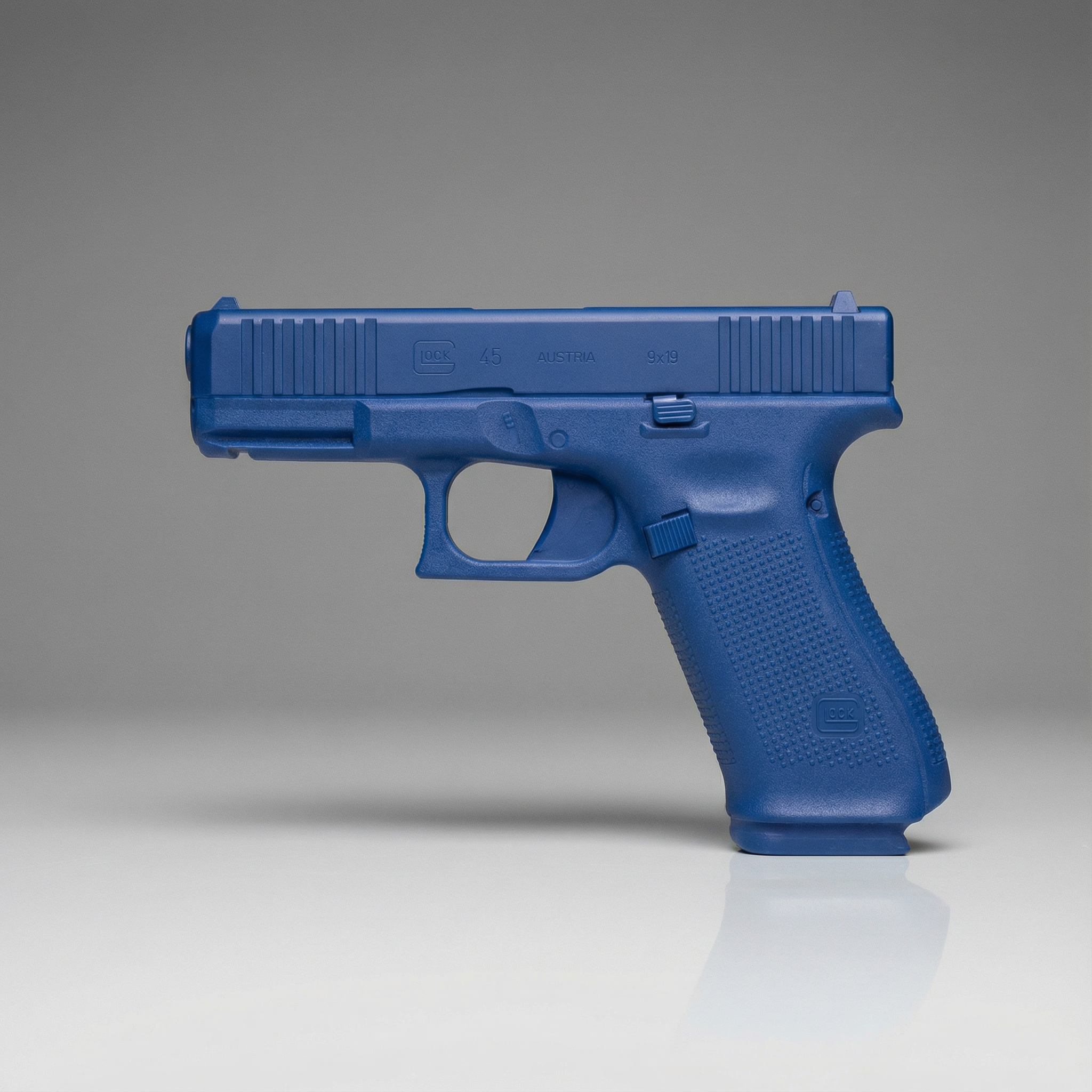 Blue gun Blue Training Guns By Rings - Glock 45 Blue Training Gun FSG45 on a gray background