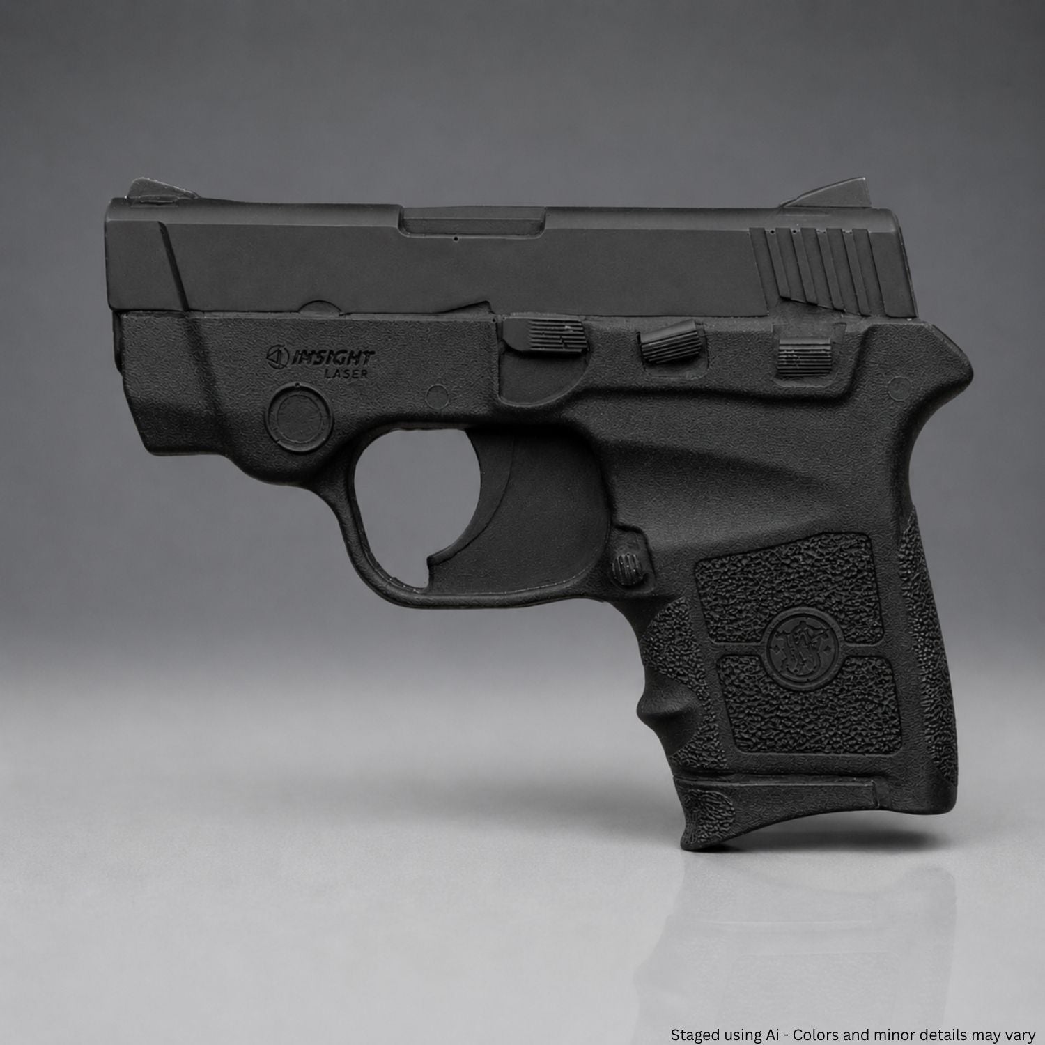 A Black Smith & Wesson Bodyguard .380 Training Gun on a gray background
