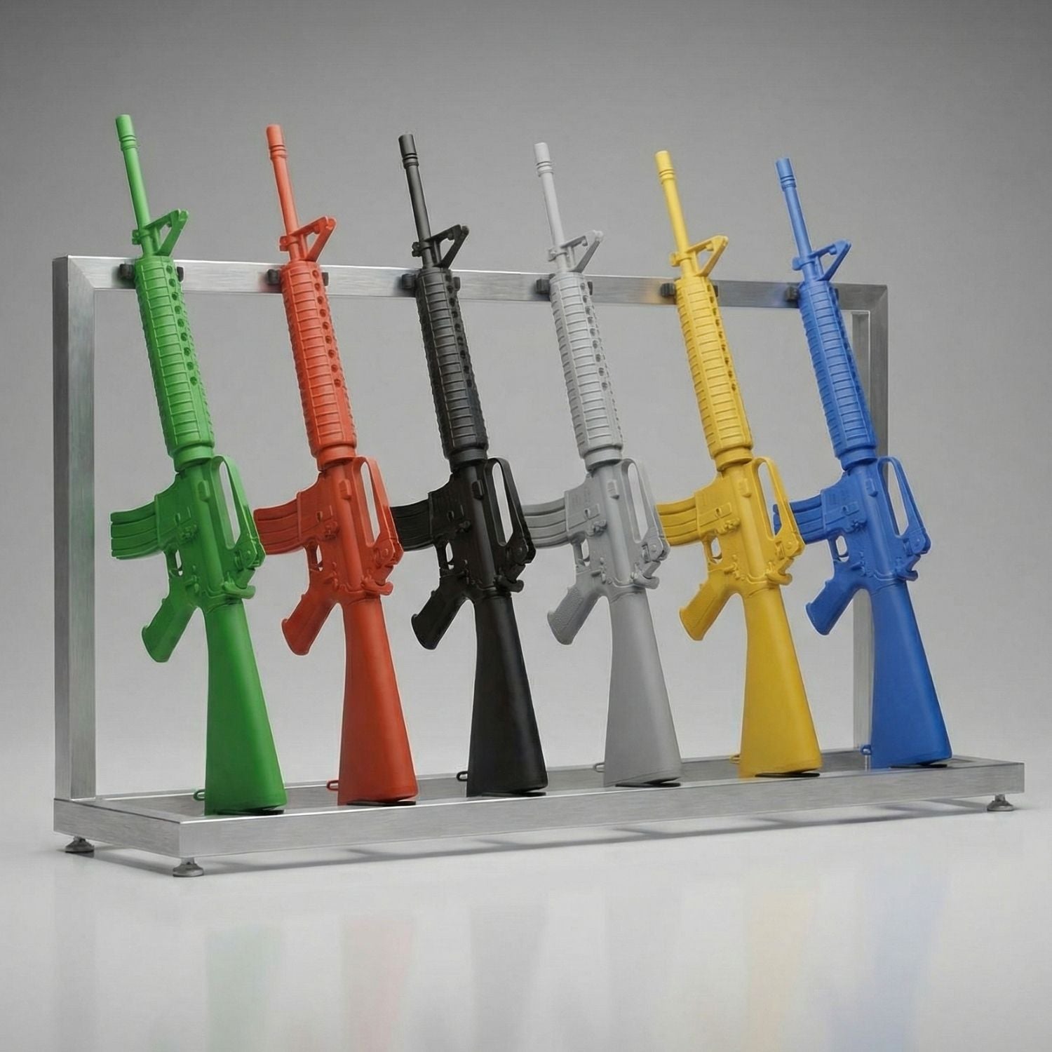 Colorful police training rifles on a stand against a gray background