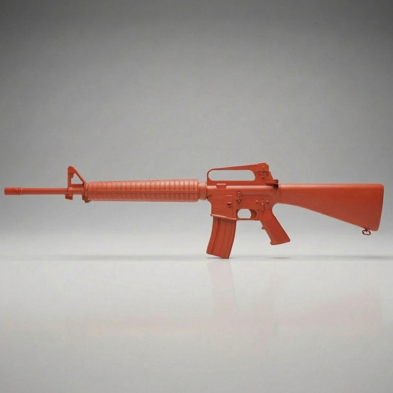 Red training rifle on a gray background for police training
