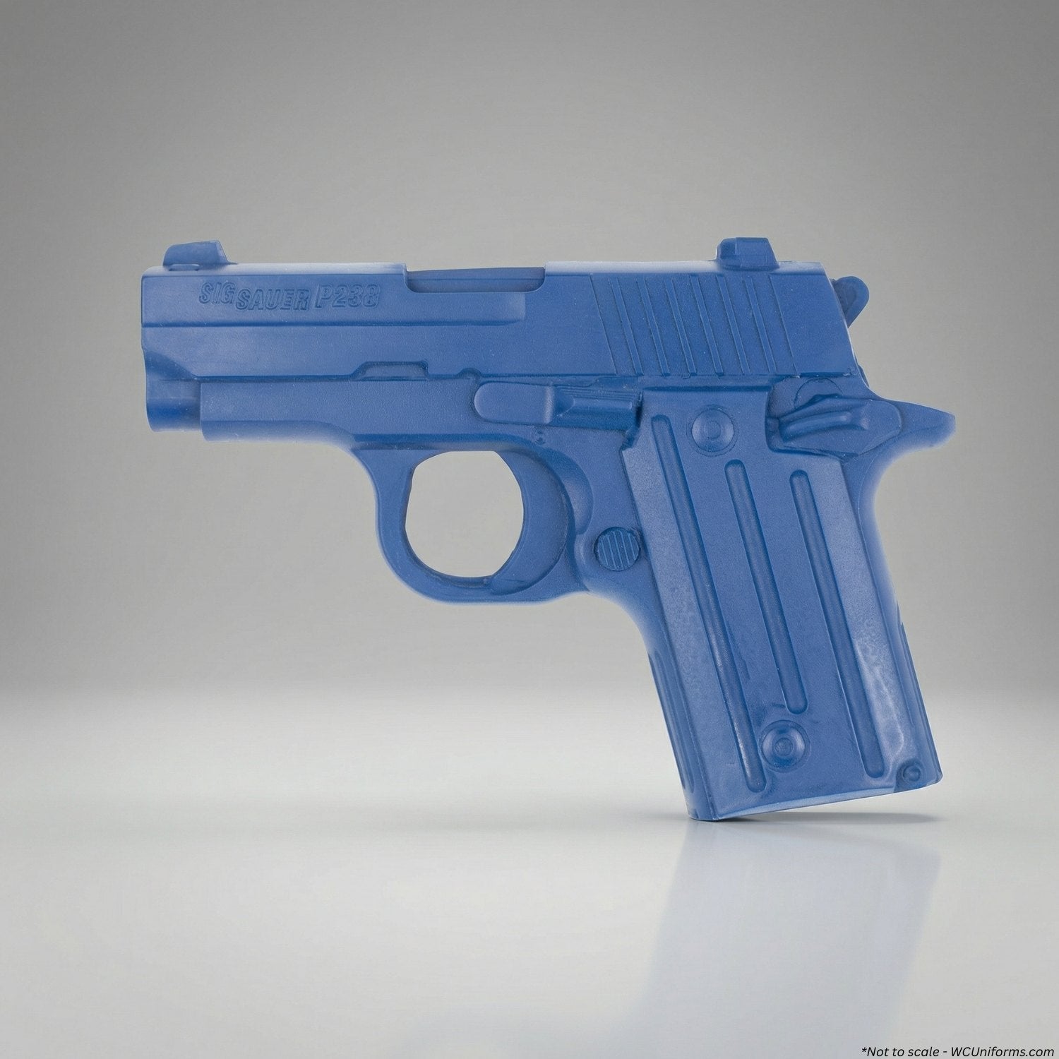 Blue plastic gun-shaped object on a gray background
