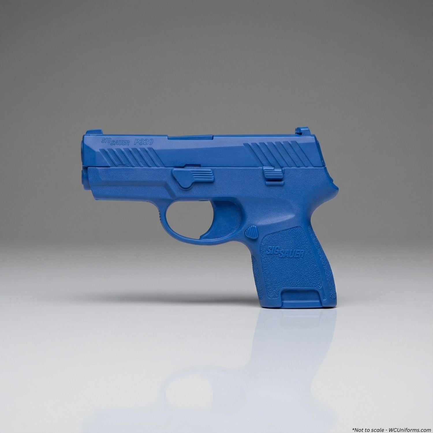 Blue Training Guns By Rings Sig Sauer P320 Sub-Compact FSP320SC on a gray background
