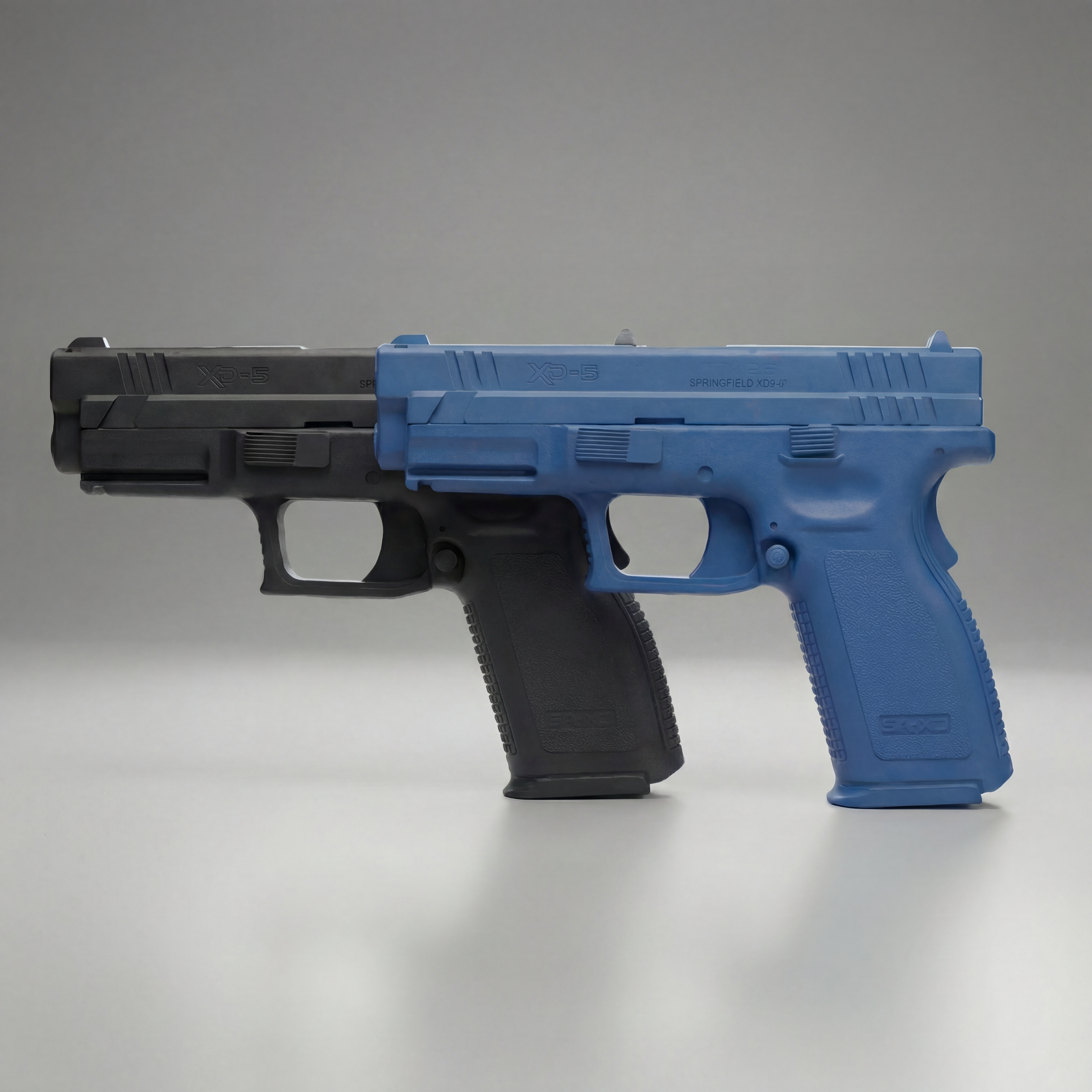 Rings Manufacturing Springfield XD9 4-inch training gun FSXD9101 in blue or black on a gray background