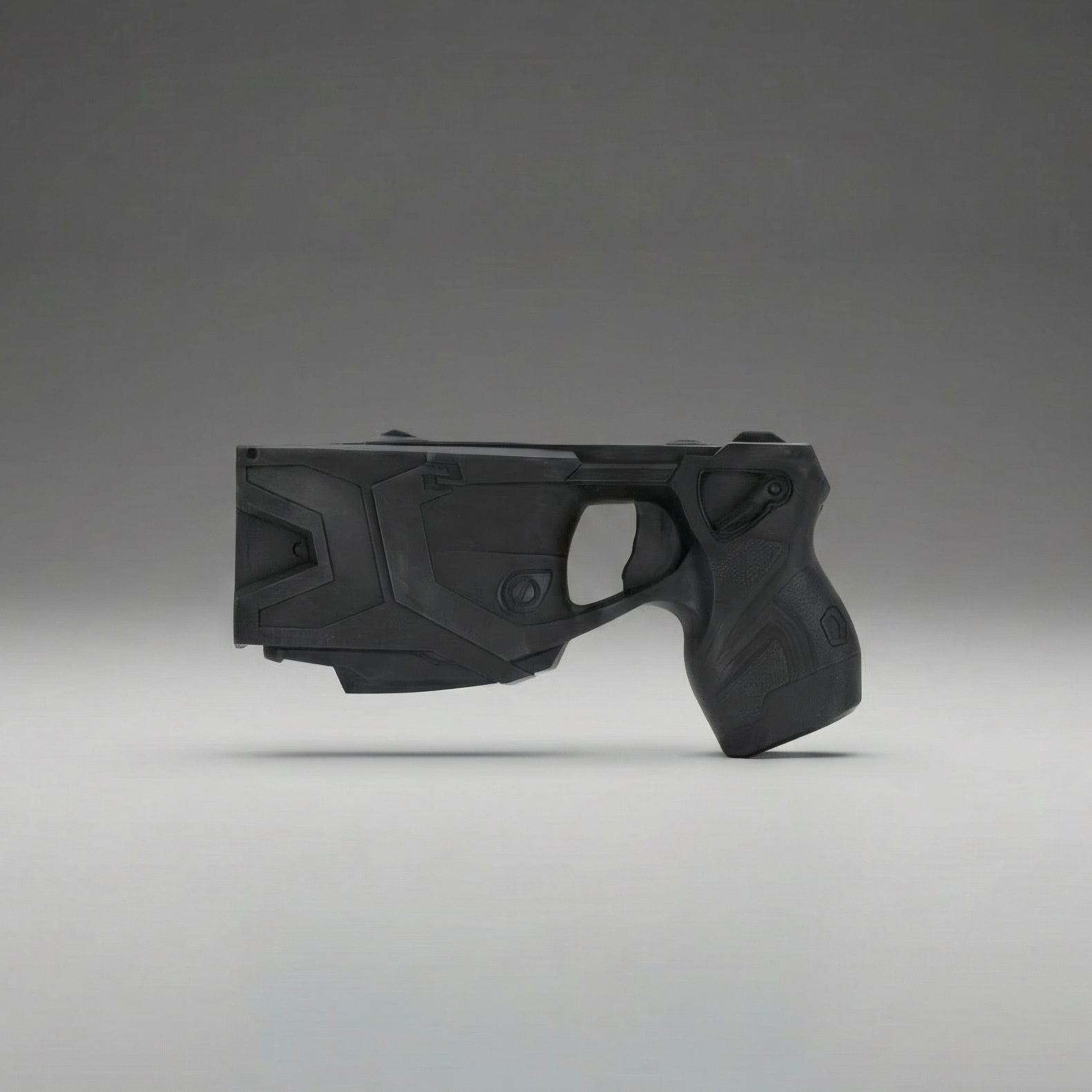 Black Taser X2 Training weapon on a gray background