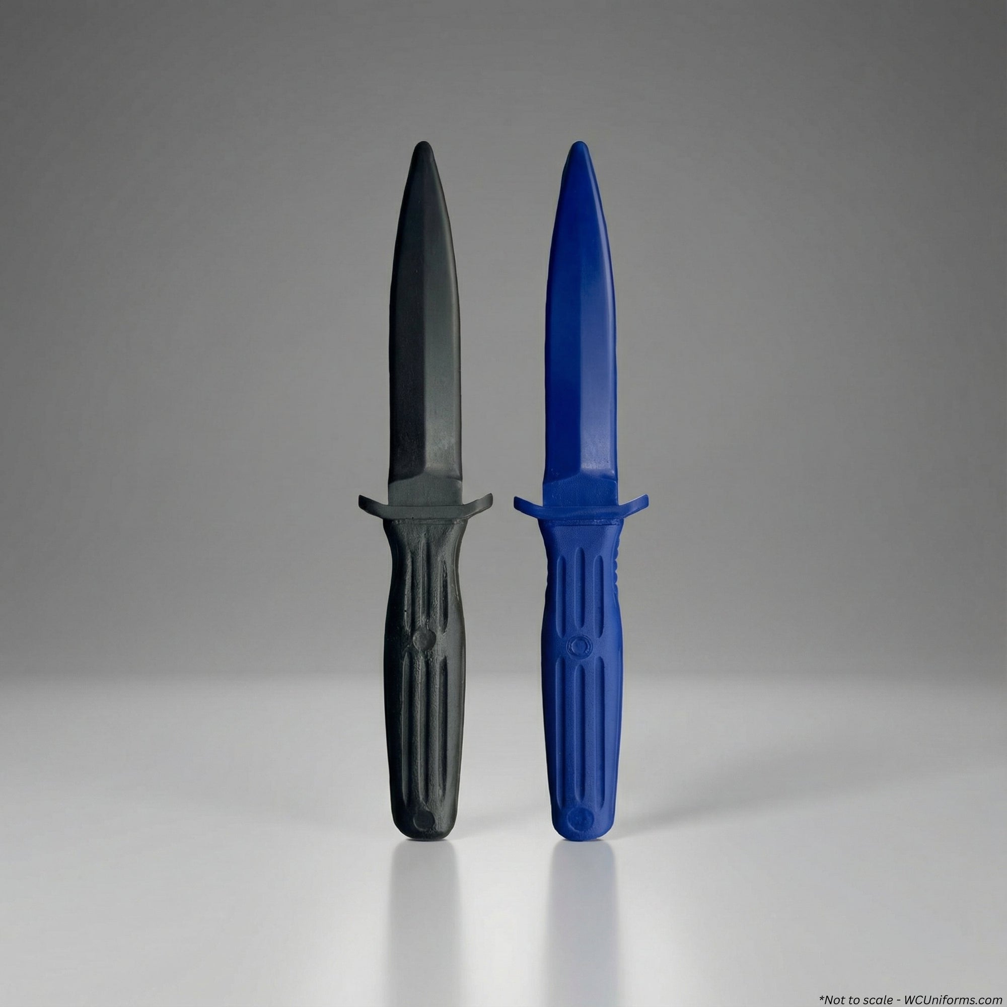 Two training knives, one with a black blade and gray handle, the other with a blue blade and handle, on a gray background.