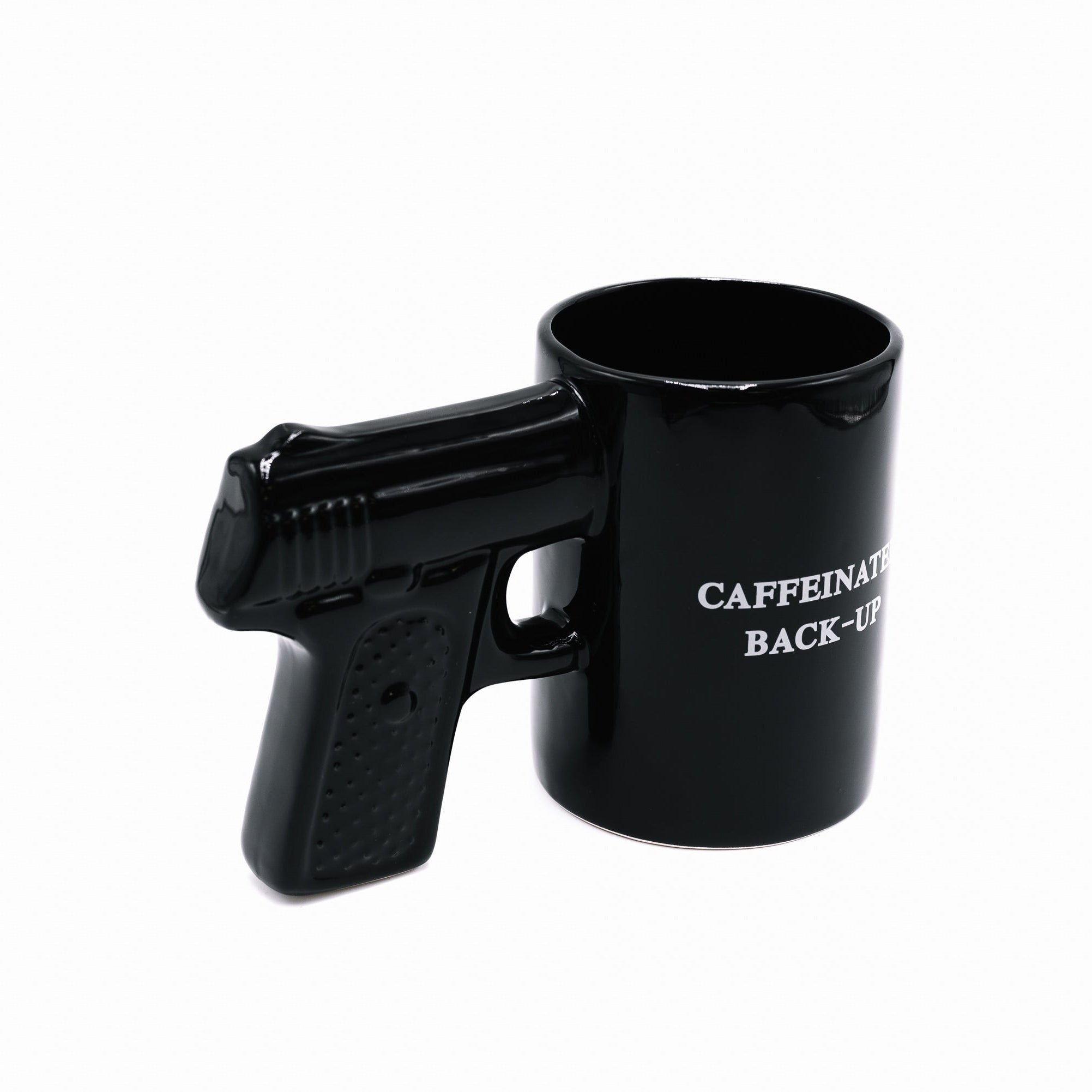 Black gun-shaped mug with 'CAFFEINATED BACK-UP' text on a white background