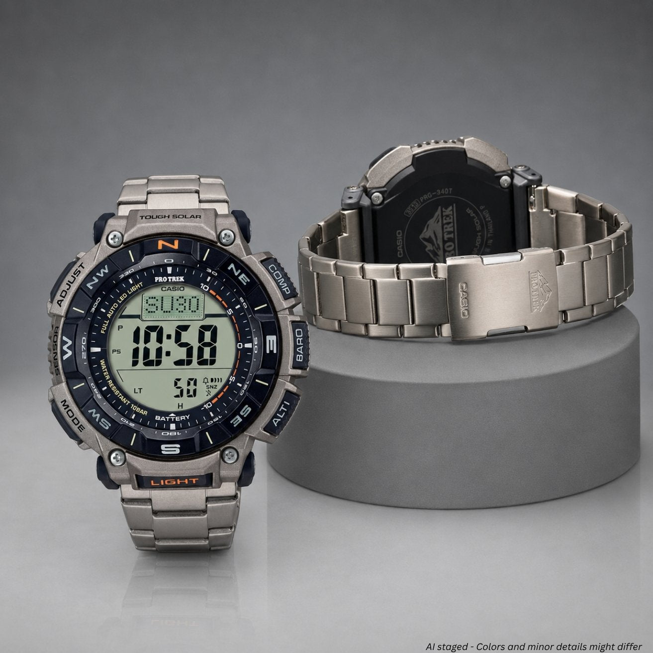 Digital watch with metallic band on a gray stand against a gray background