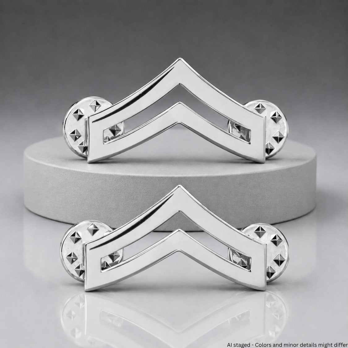 Corporal Chevron Rank Collar Pins - Nickel silver-plated pair displayed on pedestal