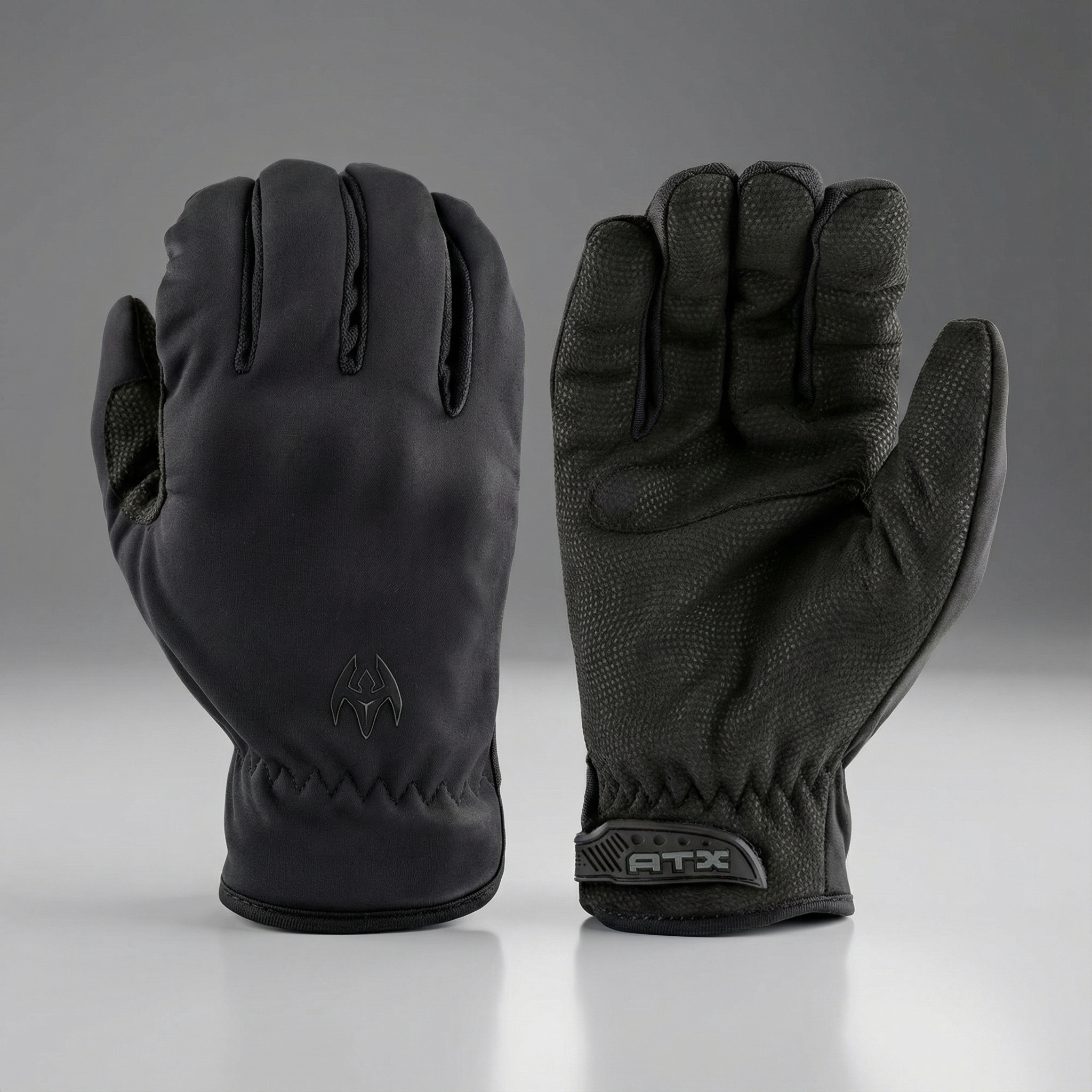 Pair of black gloves with Damascus ATX brand logos on a gray background