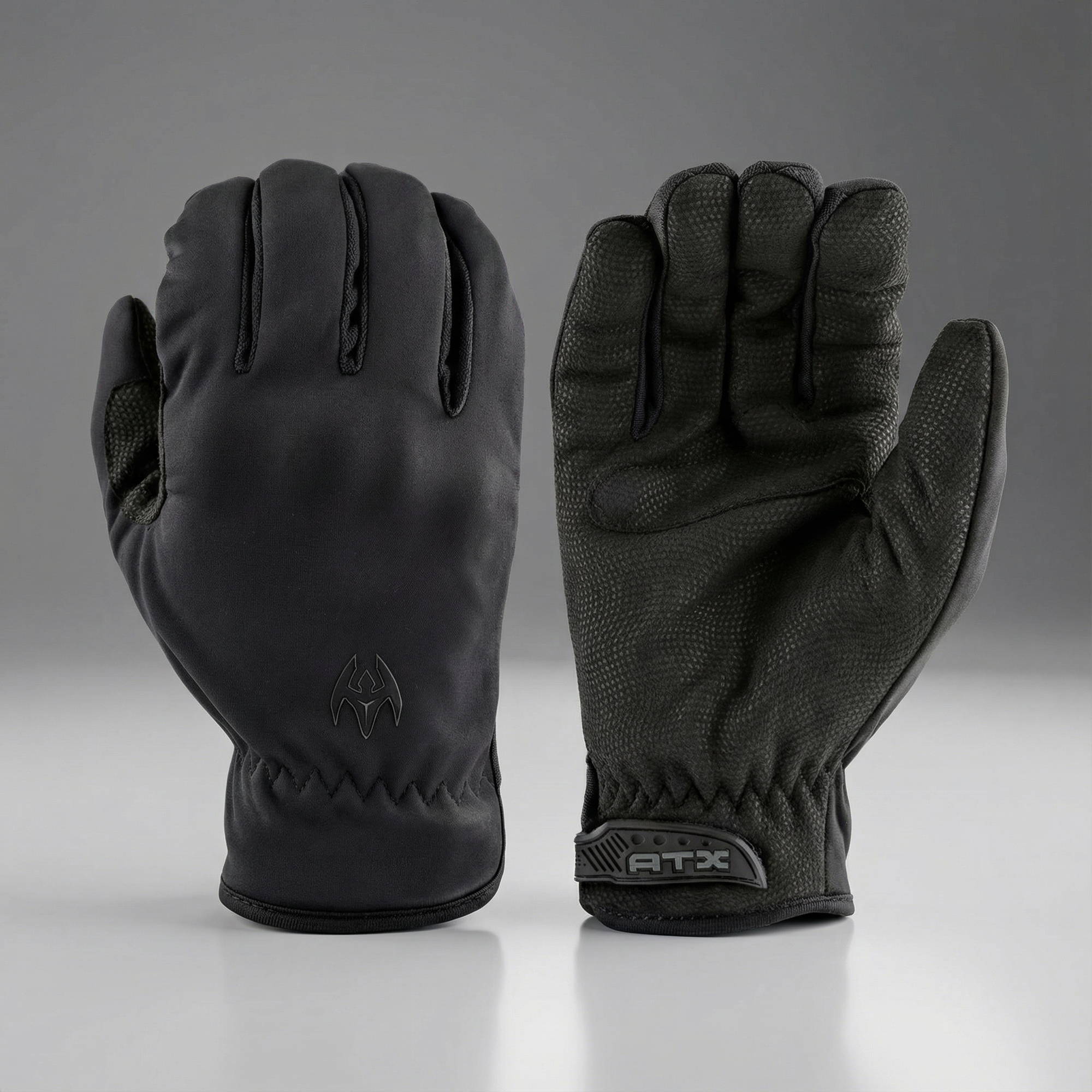 Pair of black gloves with Damascus ATX brand logos on a gray background
