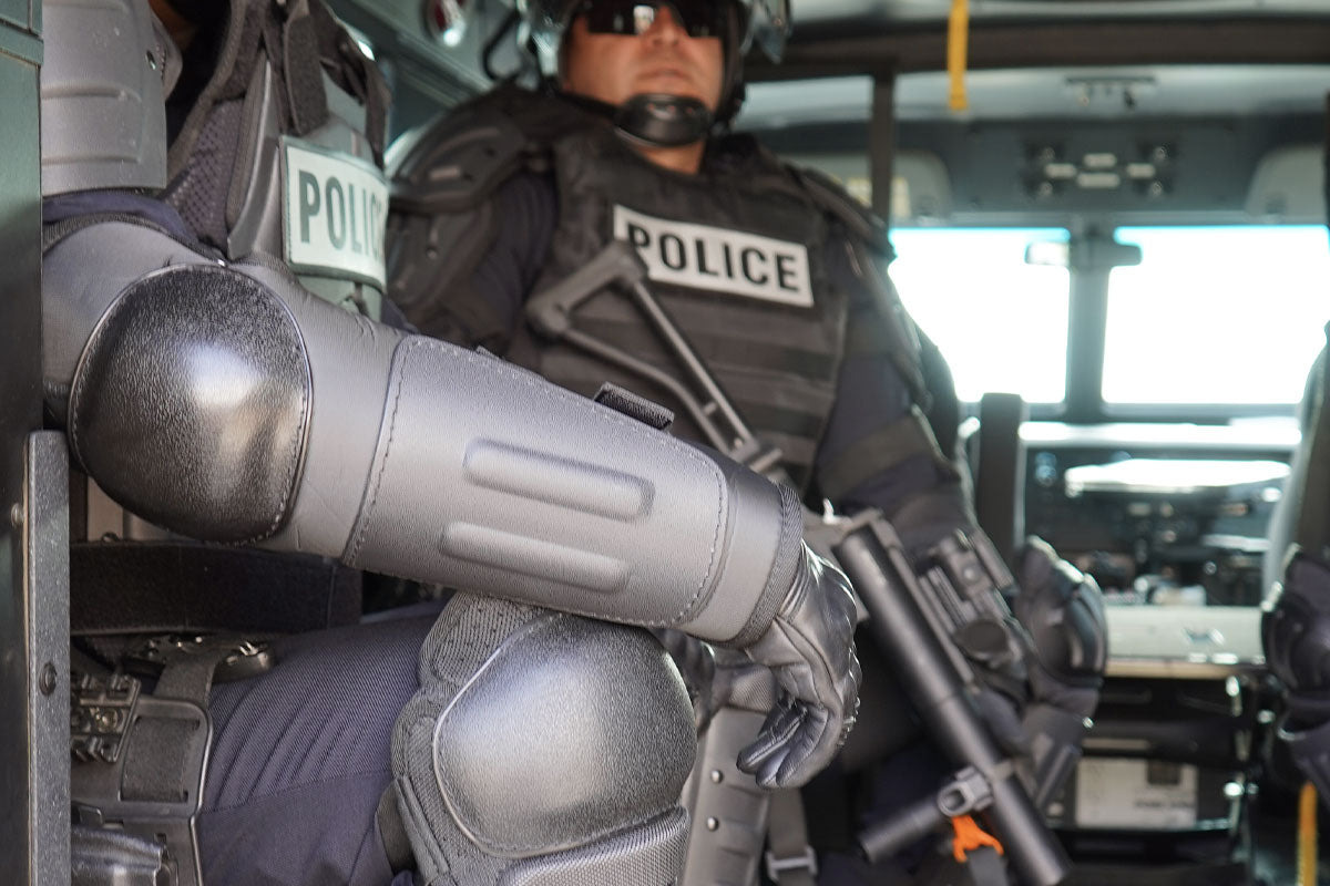 Police officer in a Bear Cat wearing Damascus Imperial FA30 Hard Shell Forearm and Elbow Protectors | FA30