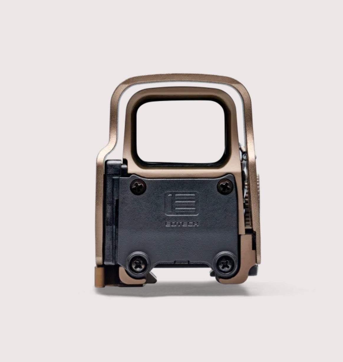 Close-up of a tactical rifle sight with a visible brand logo on a light gray background