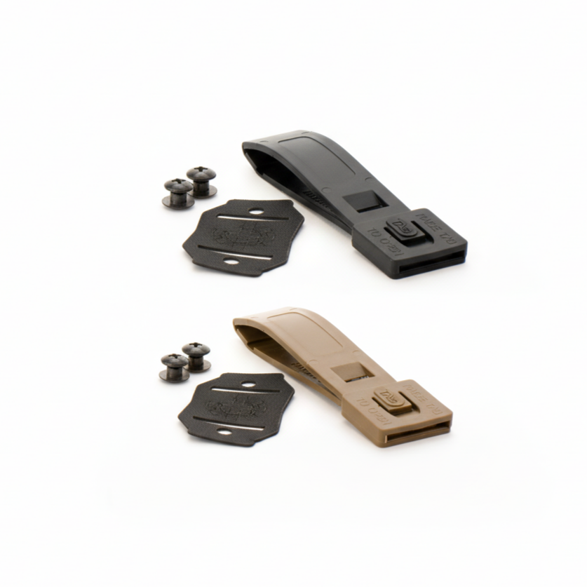 Set of black and tan metal components on a white background