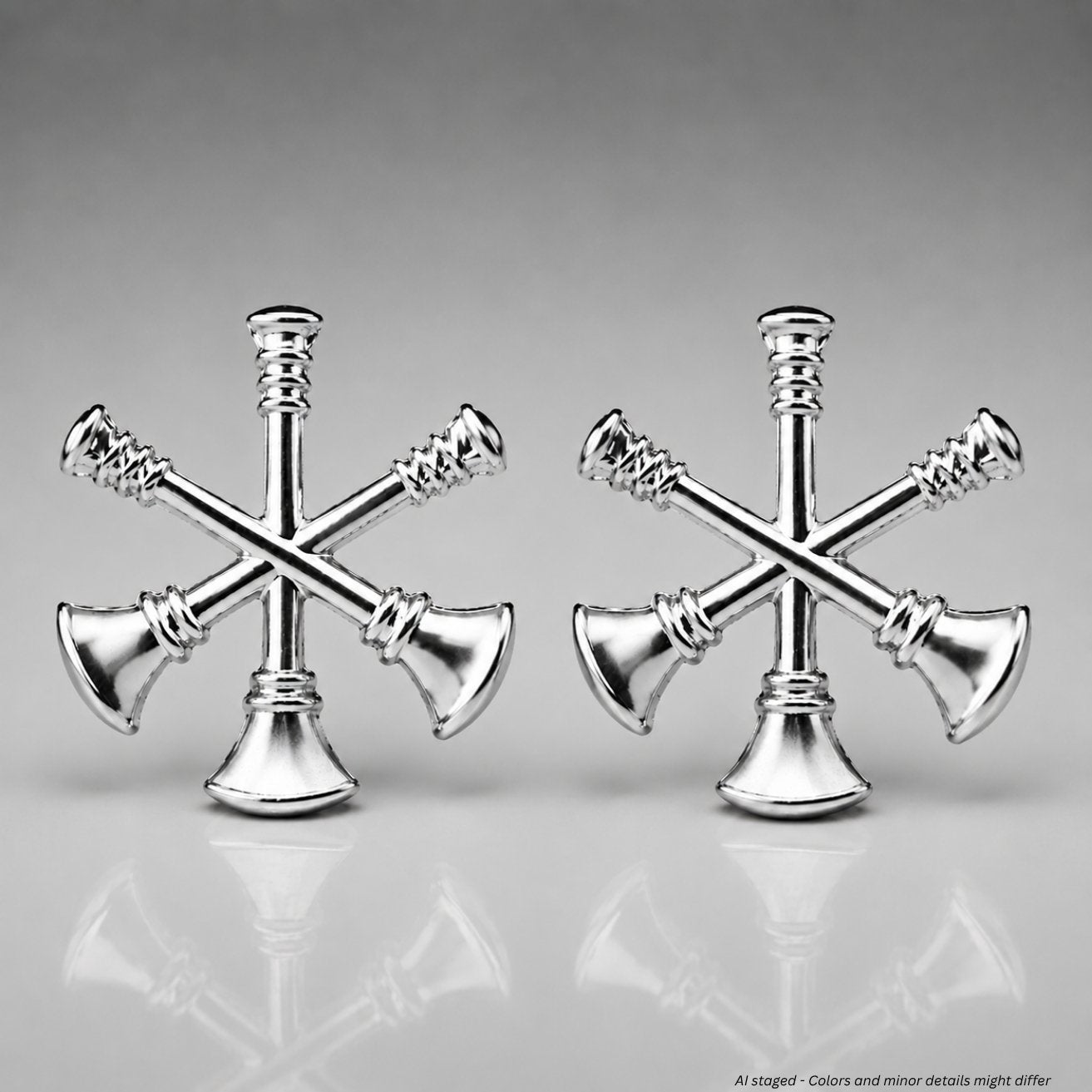 Gold and silver First Class fire bugle assistant chief collar pins displayed side by side
