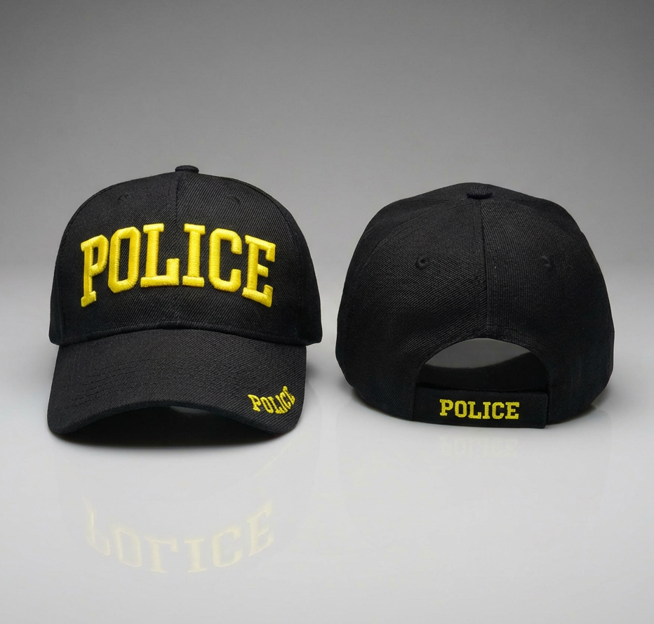 Black police cap with yellow text on a gray background