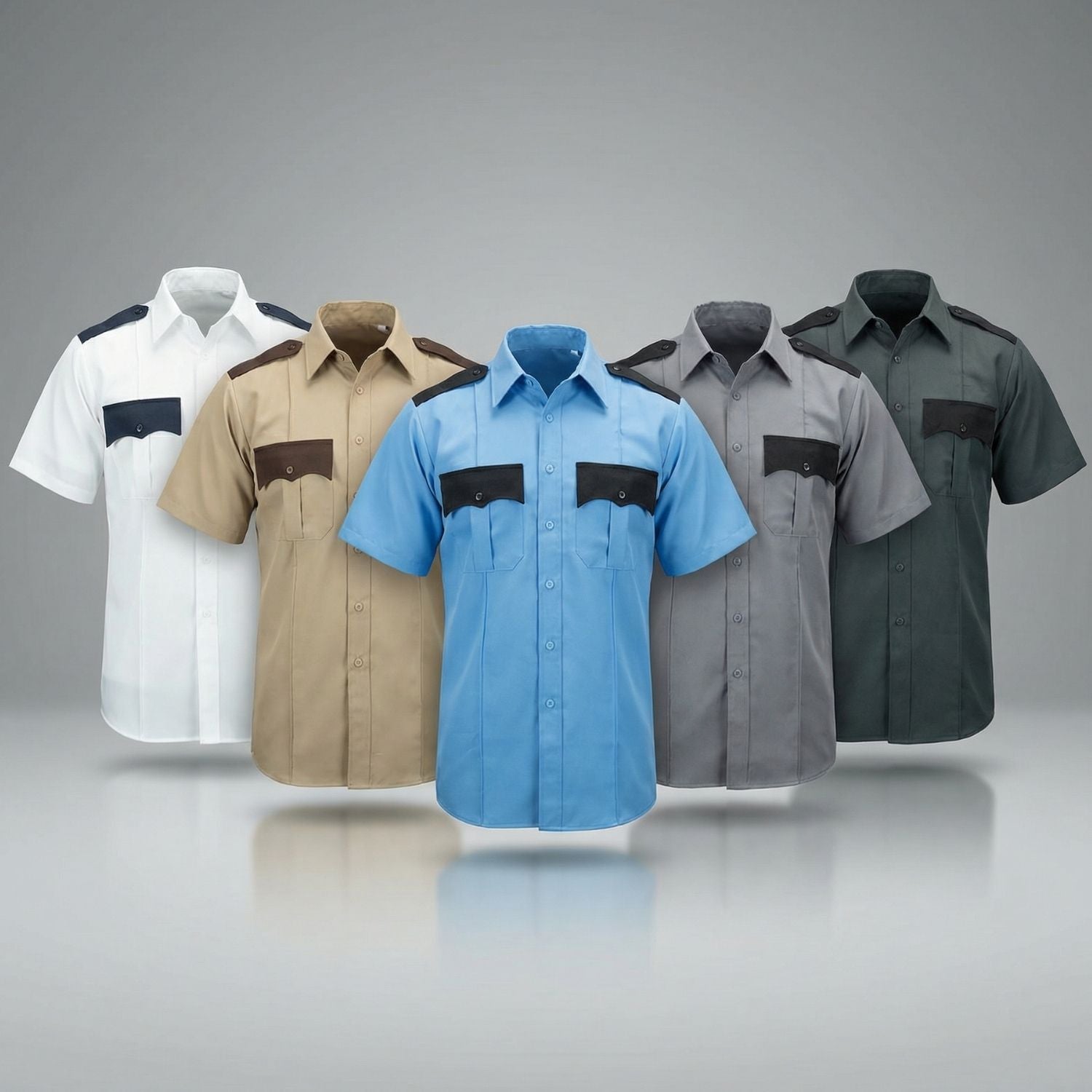 Five short-sleeve shirts in different colors on a reflective surface with a gray background