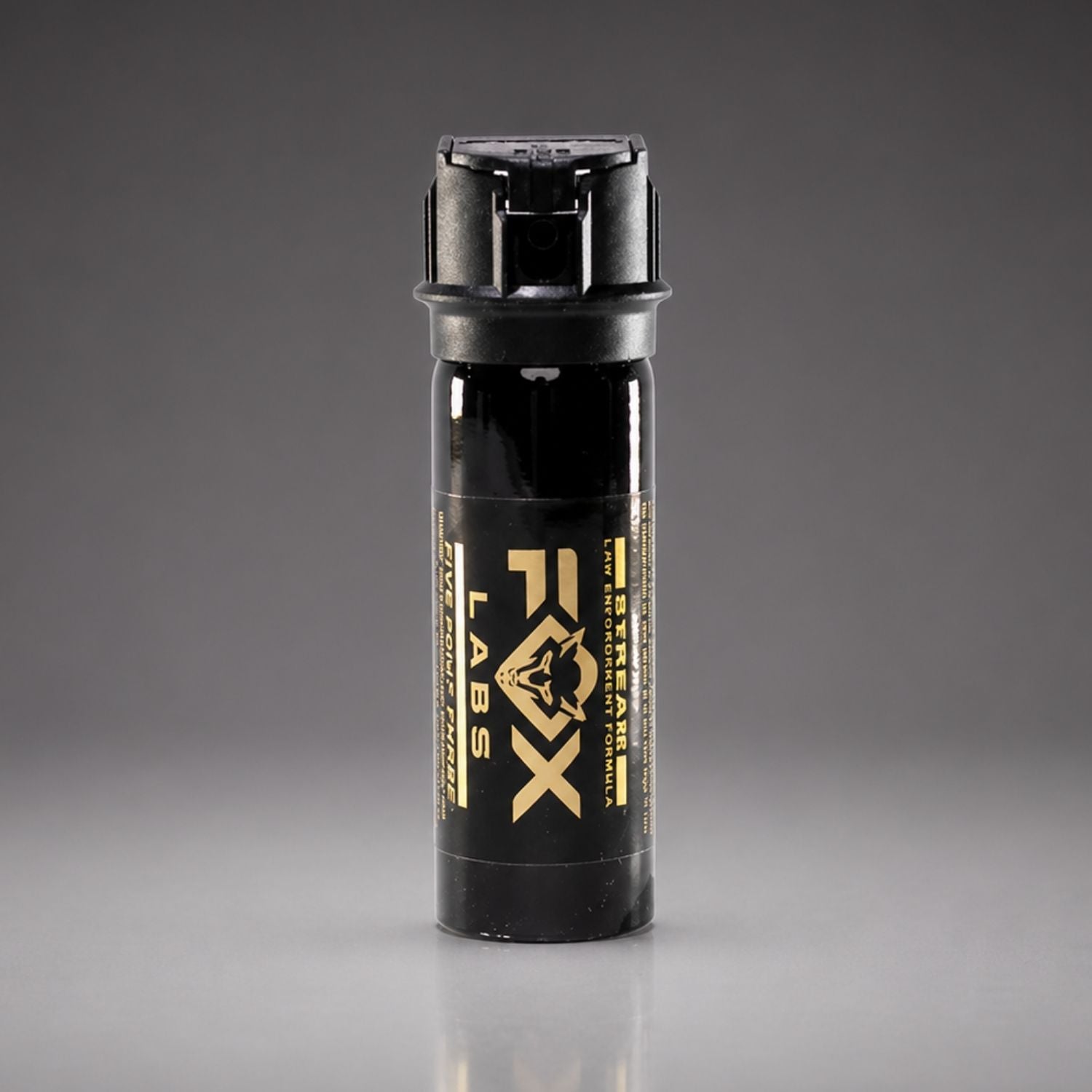 Black pepper spray canister with 'FOX Labs' branding on a gray background