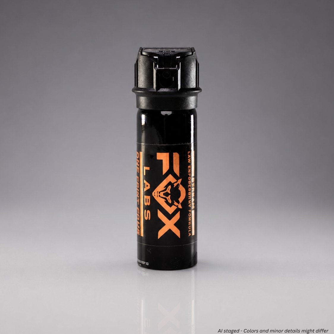 Black pepper spray canister with orange logo on a gray background