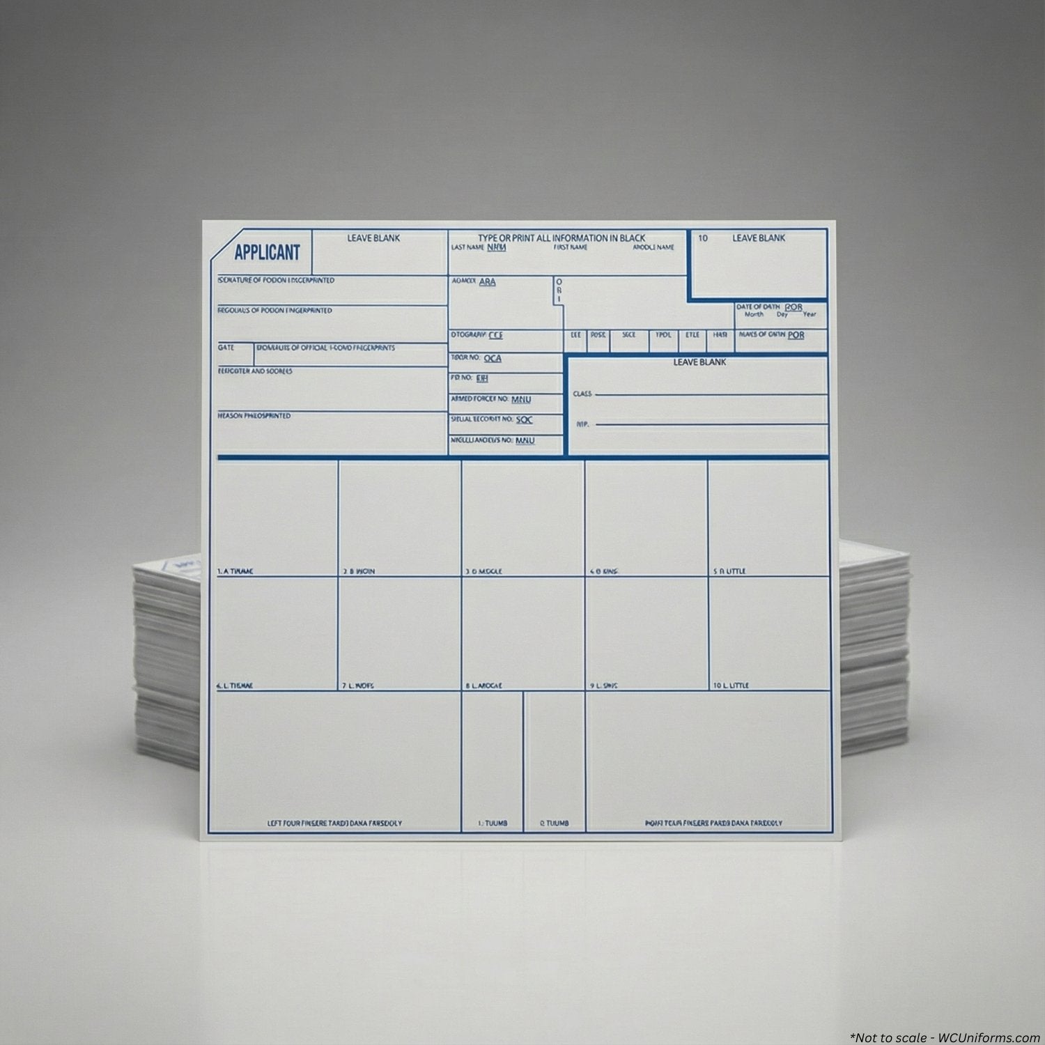 Stack of blank fingerprint forms on a gray background