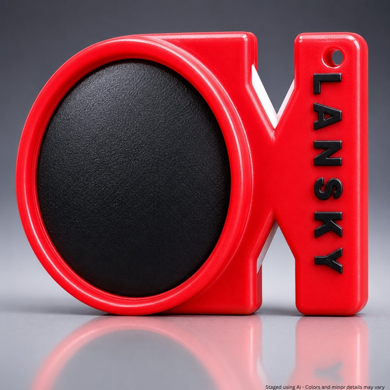 Red and black blade sharpening tool with 'Lansky' branding on a gray background