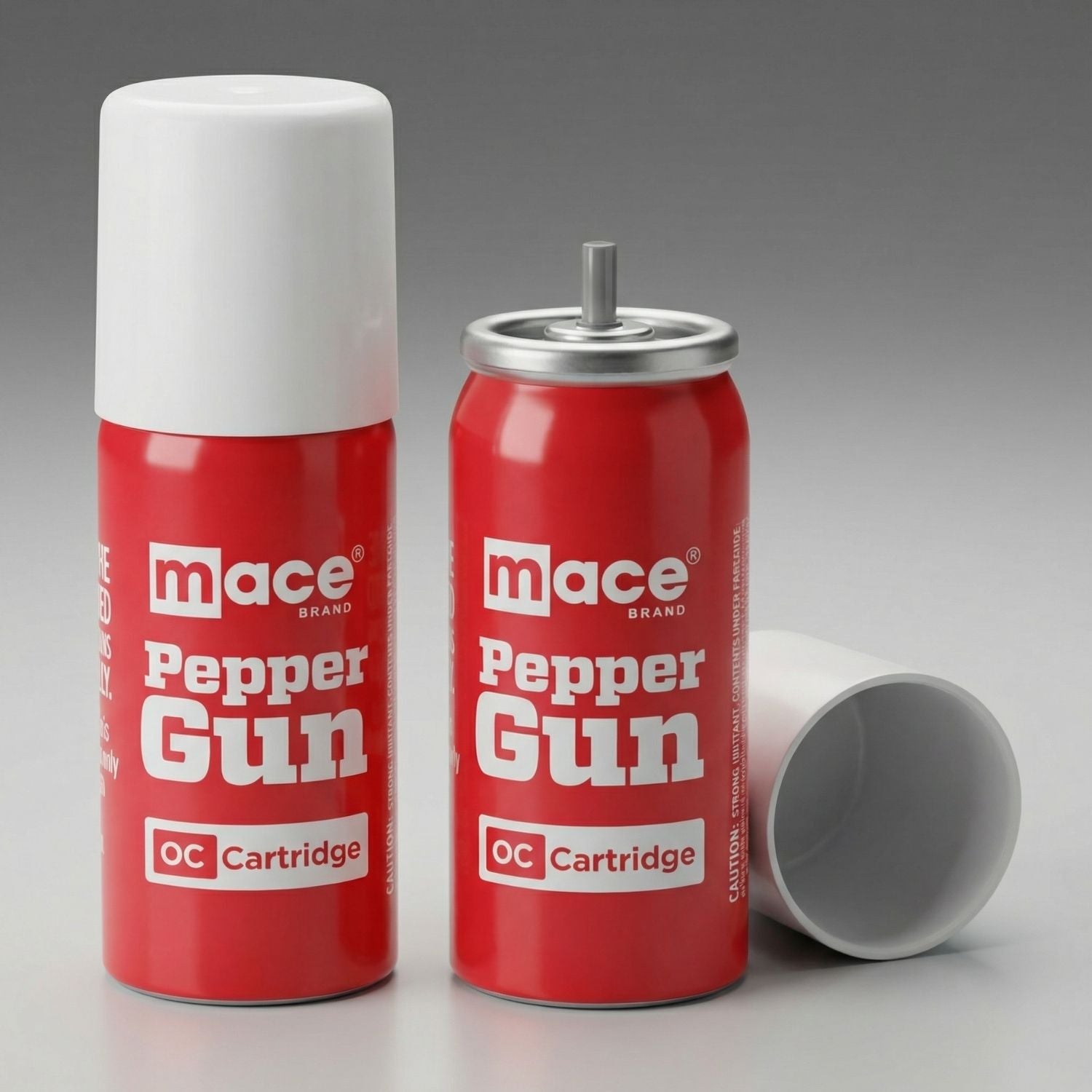 Two Mace Pepper Gun OC Cartridge cans on a gray background