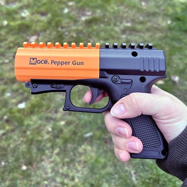 MACE Pepper Gun 2.0 10% OC Spray 80586 - Long-Range, LED Light shown being held in a users hand