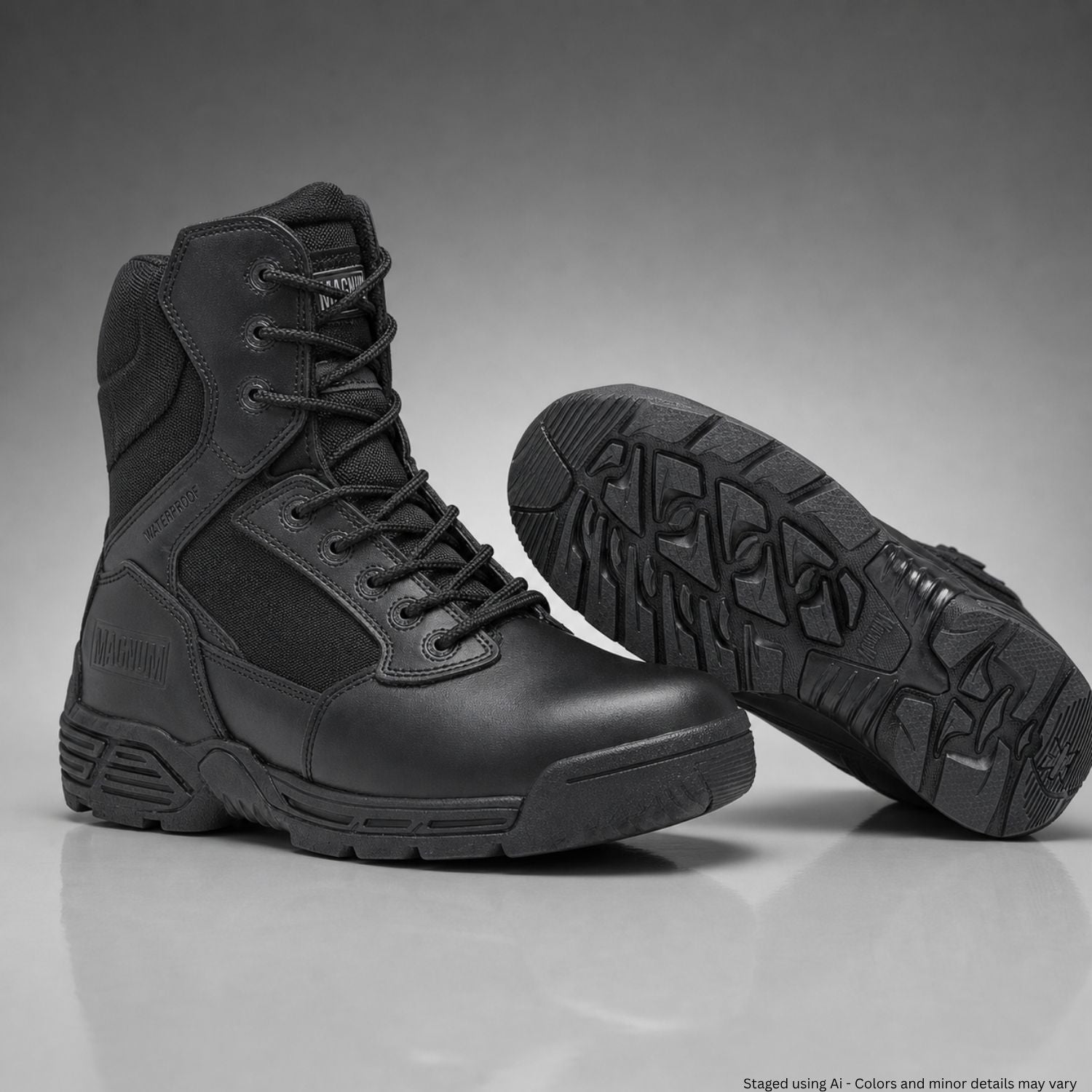 Black tactical boots on a gray background