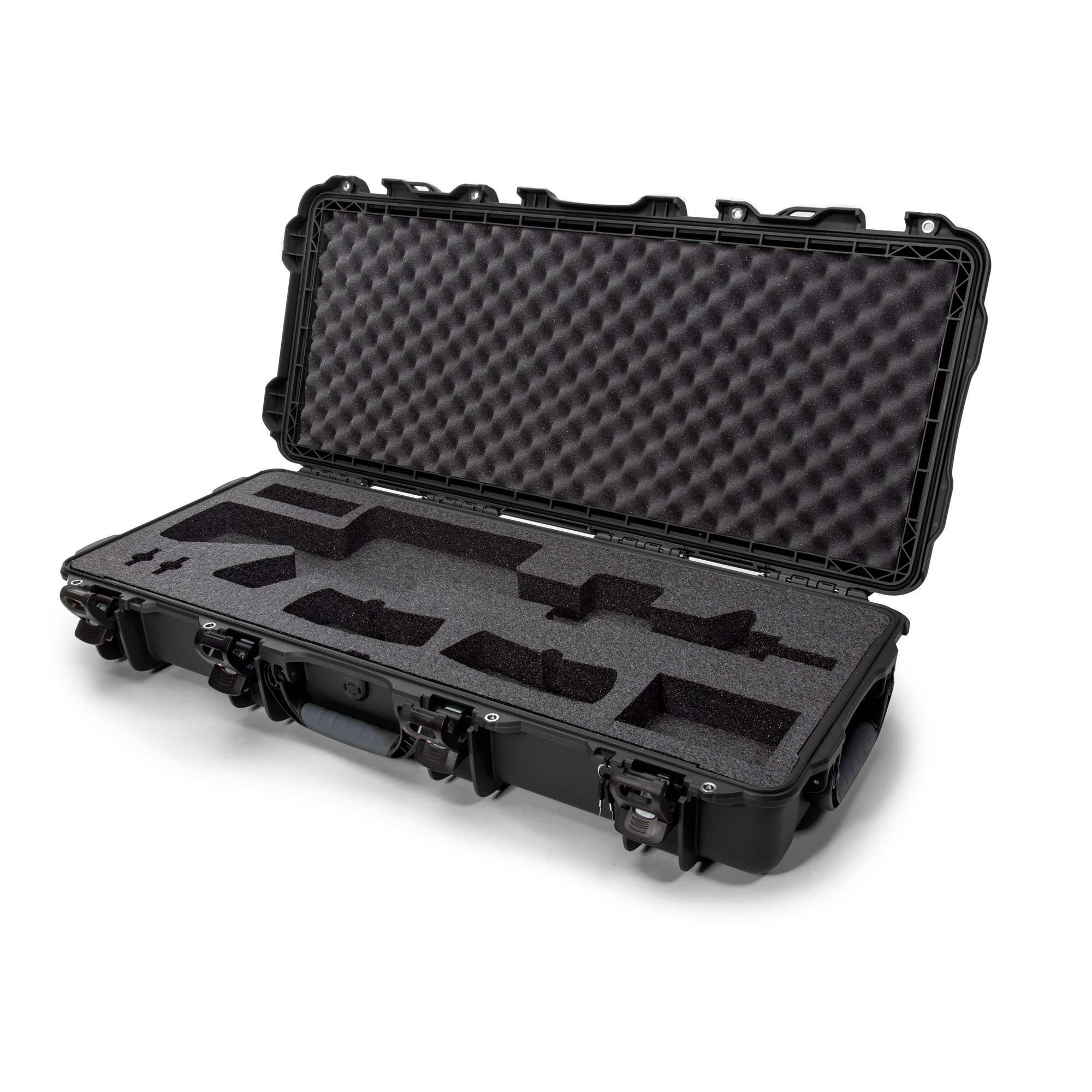 Open Nanuk 985 hard case with foam interior, showcasing its protective compartments and durable design for secure storage.