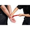 A person applying red training disposable handcuffs on another person against a white background