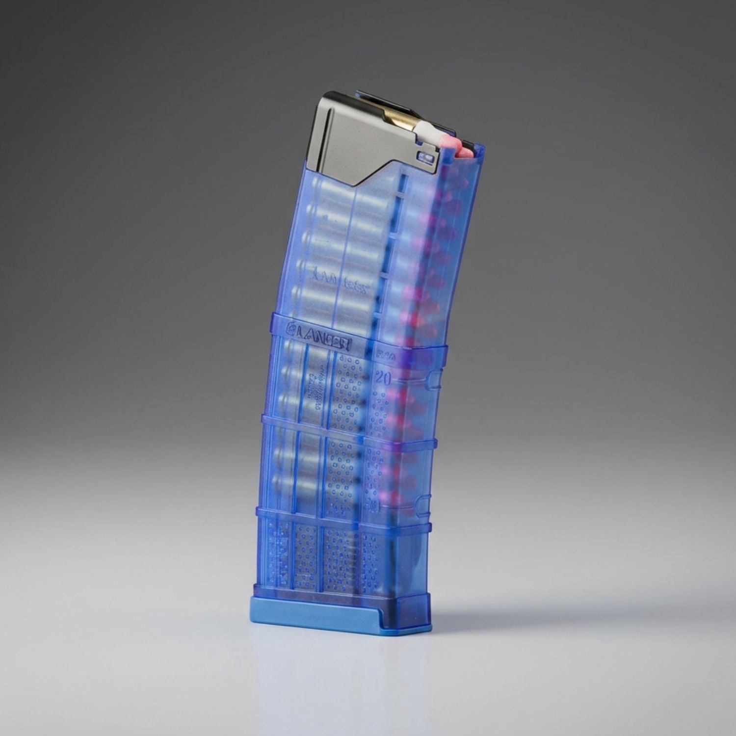 Blue transparent magazine with metallic top on a gray background