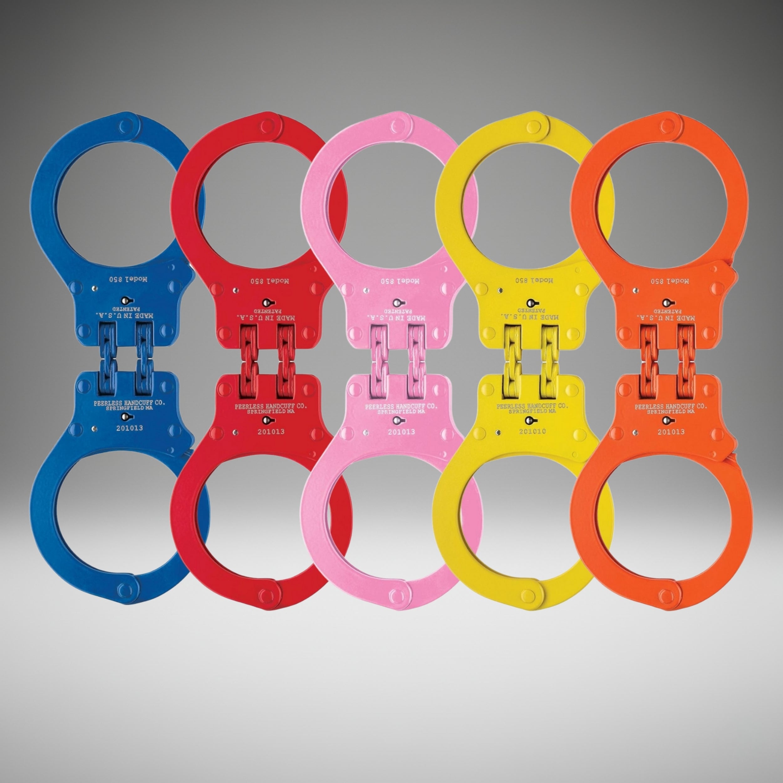 Set of colorful handcuffs on a gray background