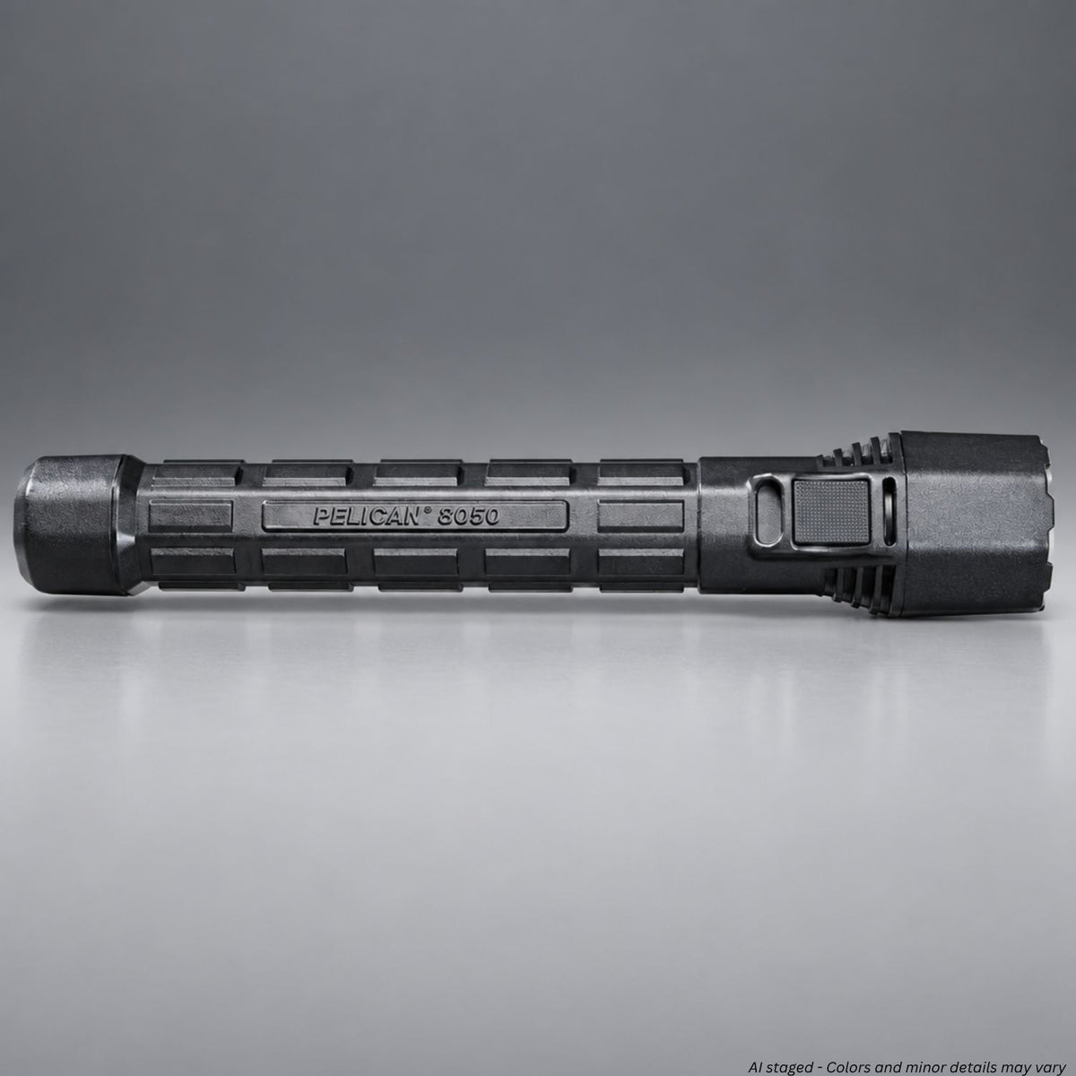 Pelican M11 8050 rechargeable flashlight in black, side view showing textured grip and switch