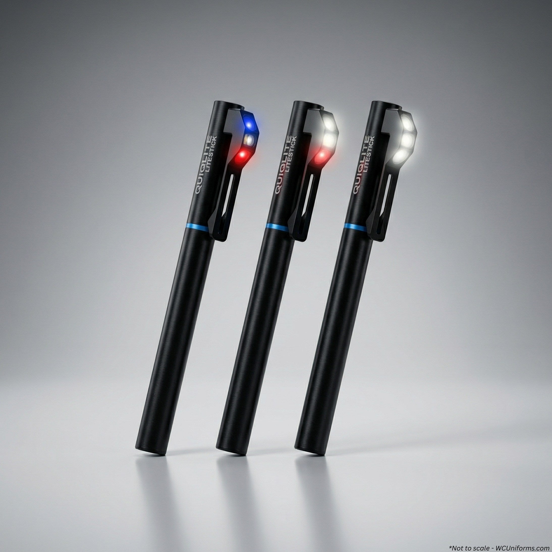 All three variants of the QuiqLite LiteStick Hands-Free LED Pocket Light for First Responders on a gray background