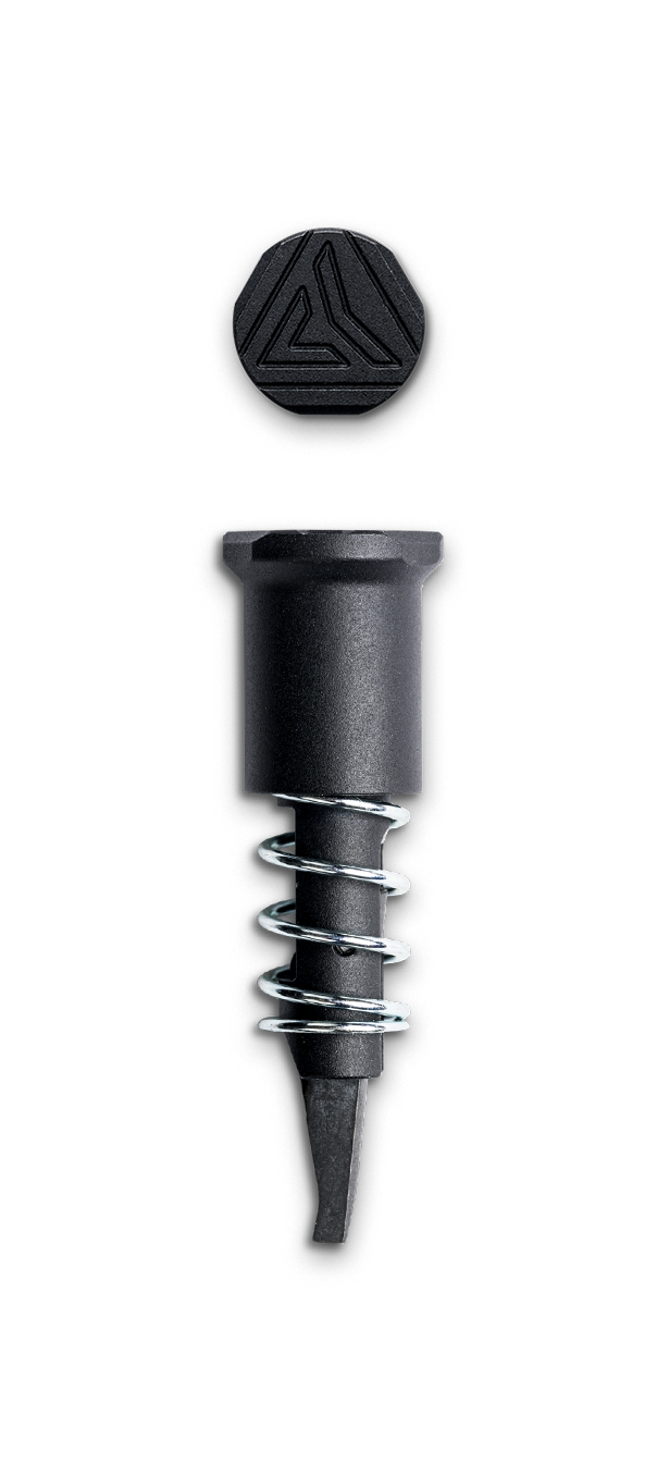 Radian Forward Assist component in black aluminum with spring, designed for AR15, featuring a stylish hex top.