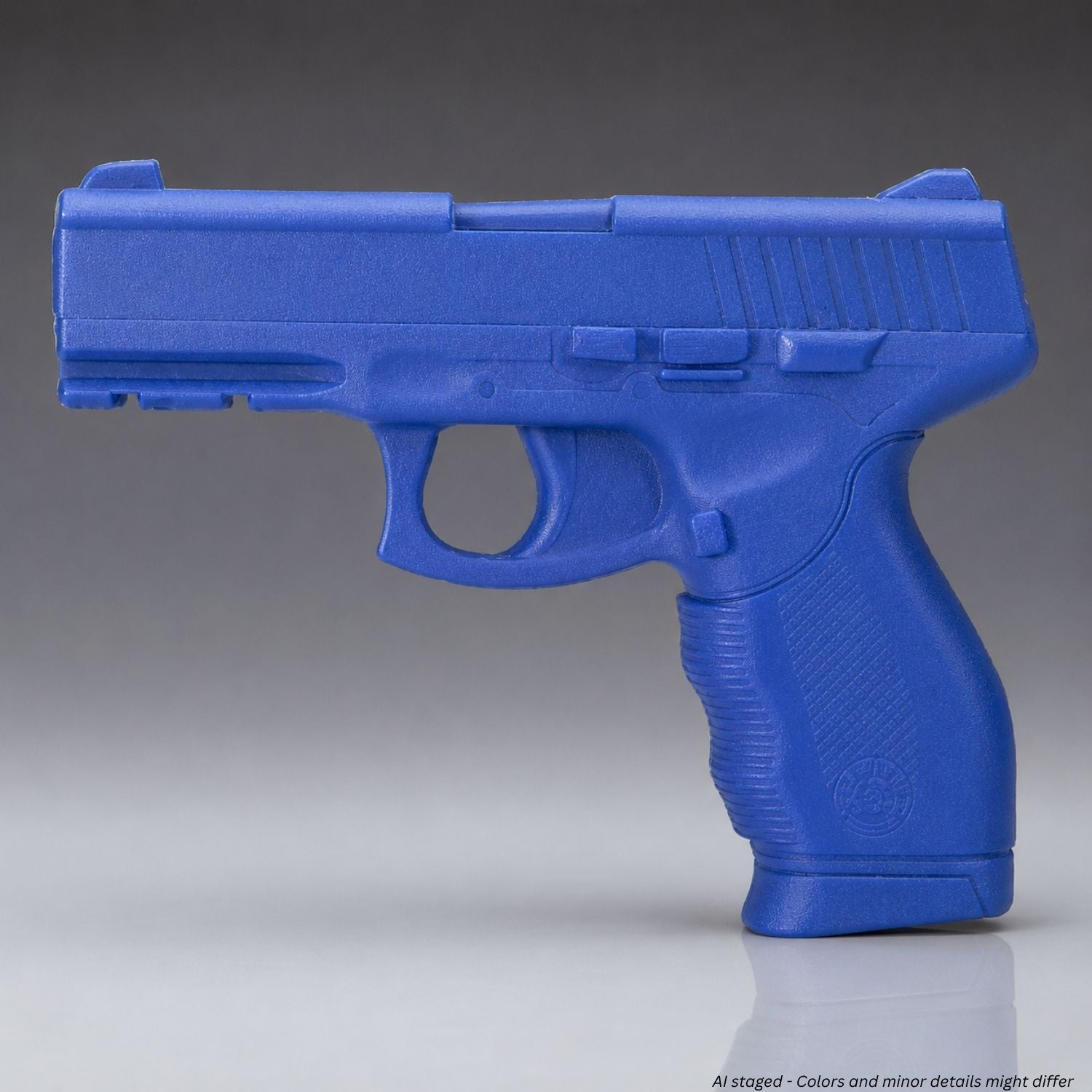 Blue plastic gun model on a gray background