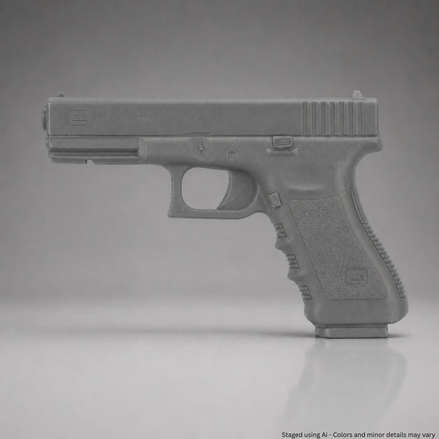 Gray training handgun on a gray background