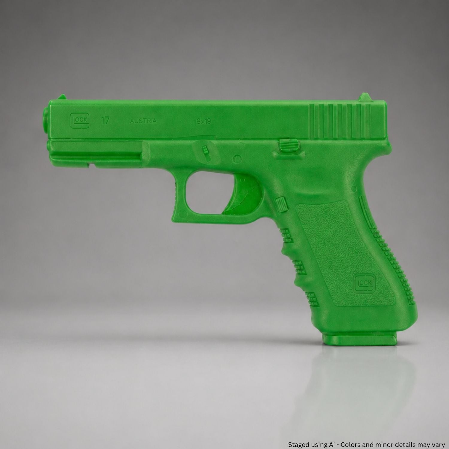 Green training gun on a gray background