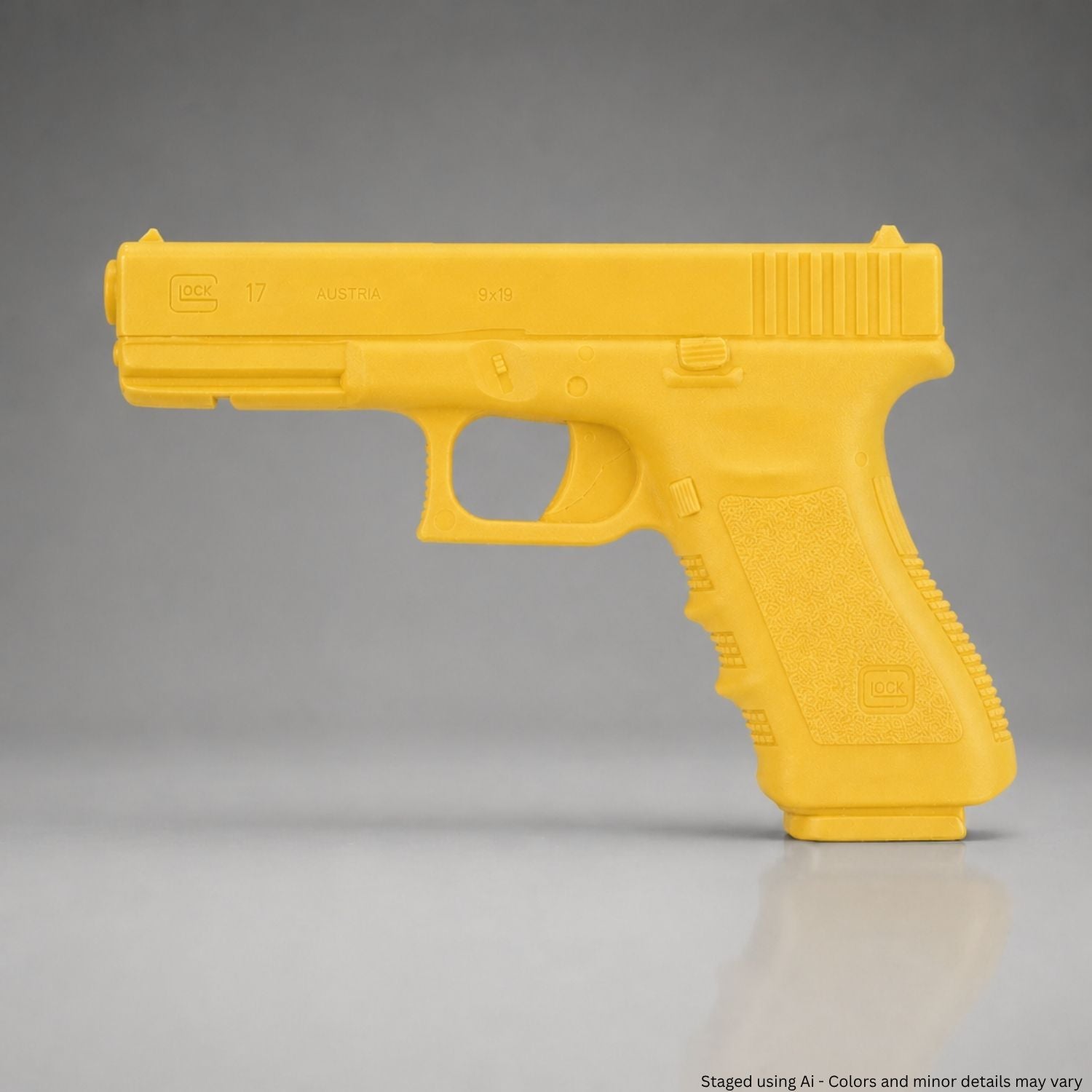 Yellow training gun on a gray background