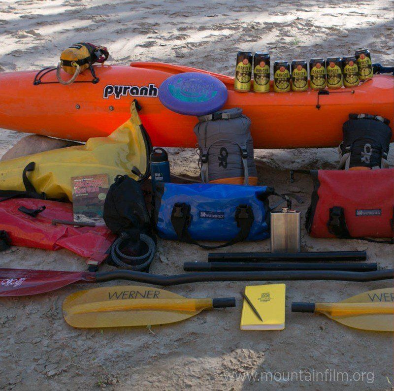 Kayak with gear on a sandy beach
