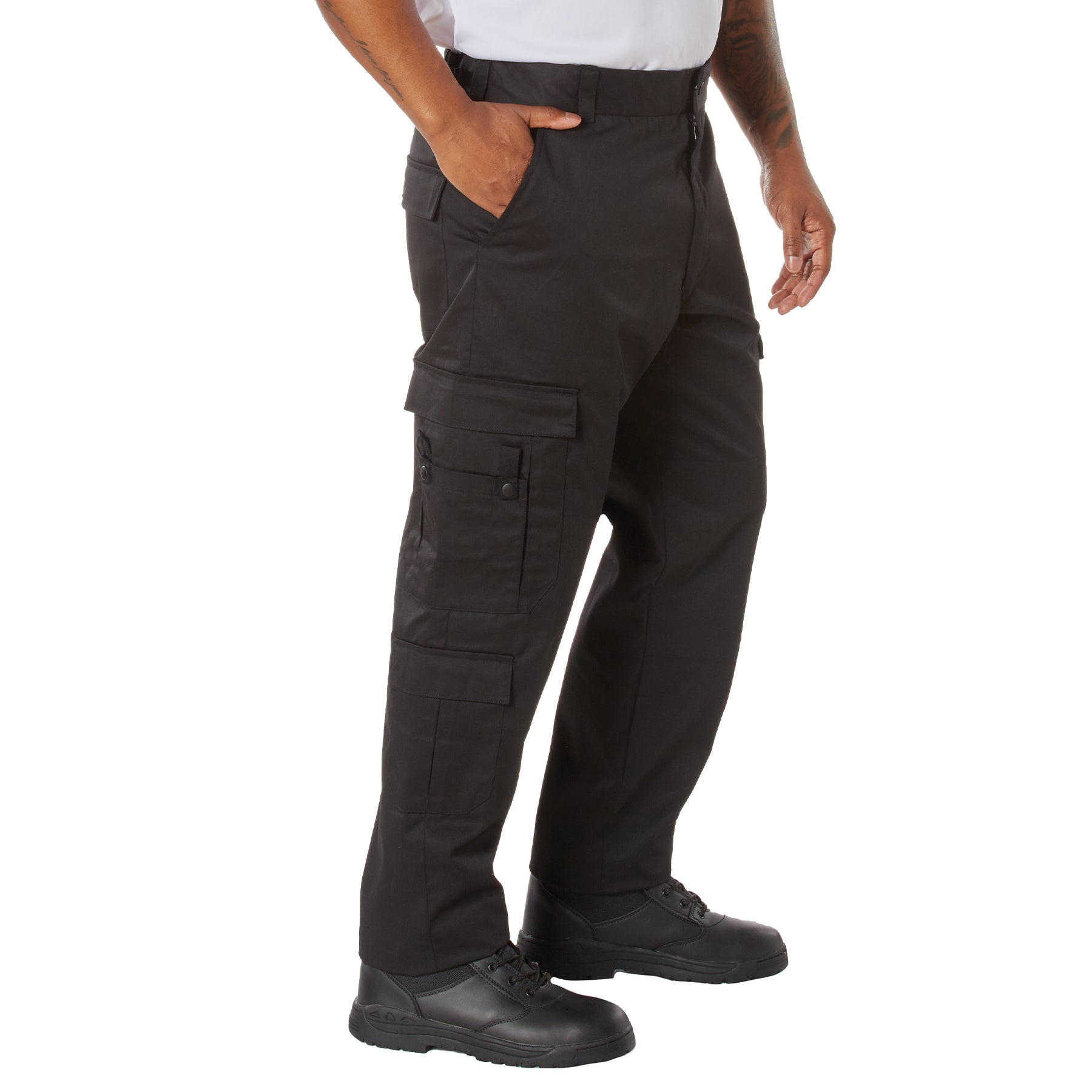 Person wearing black cargo pants on a white background
