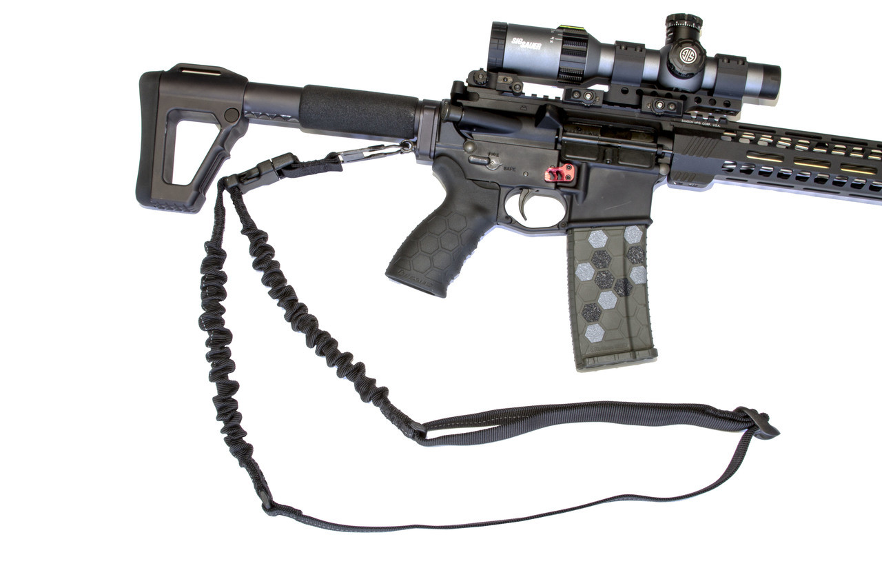 Hexmag Single Point Sling attached to a rifle, featuring bungee stretch for comfort and a quick release buckle.