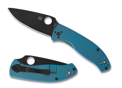 Spyderco Tenacious knife featuring a black oxide-coated blade and blue titanium handle scales, showcasing sleek design and functionality.