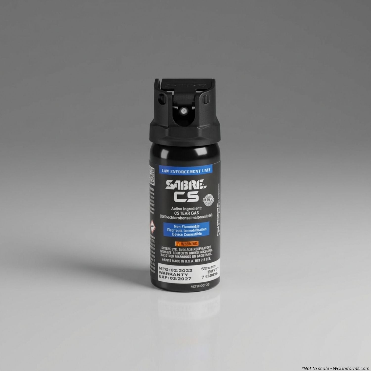 Black pepper spray canister with visible branding on a gray background