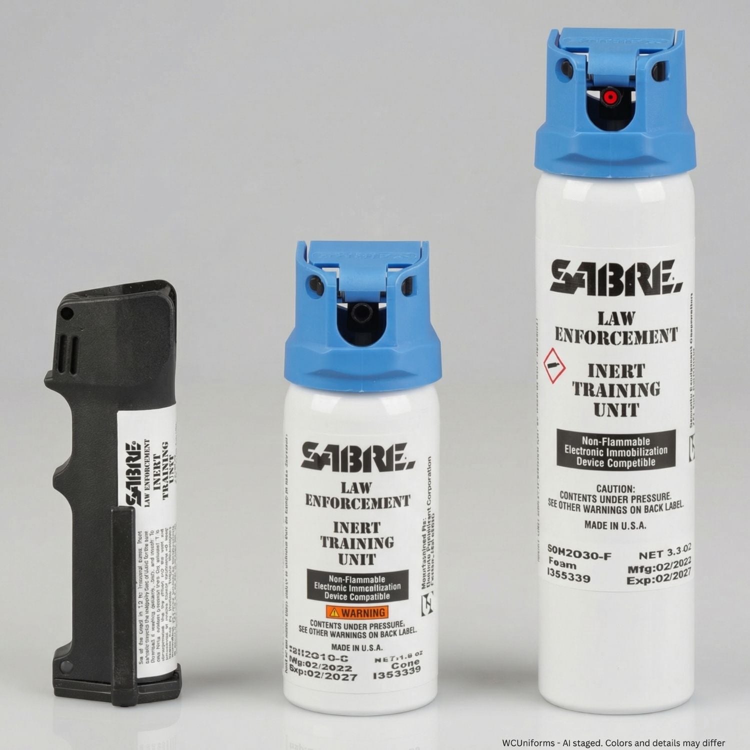 Three Sabre law enforcement inert training units on a gray background