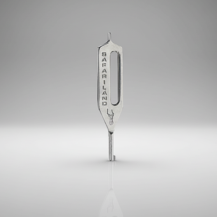 Silver Safariland HK-10 Slotted Oversized Stainless Handcuff Key 1103410 on a gray background