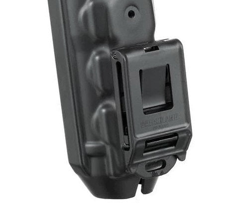 Black plastic clip or fastener on a white background