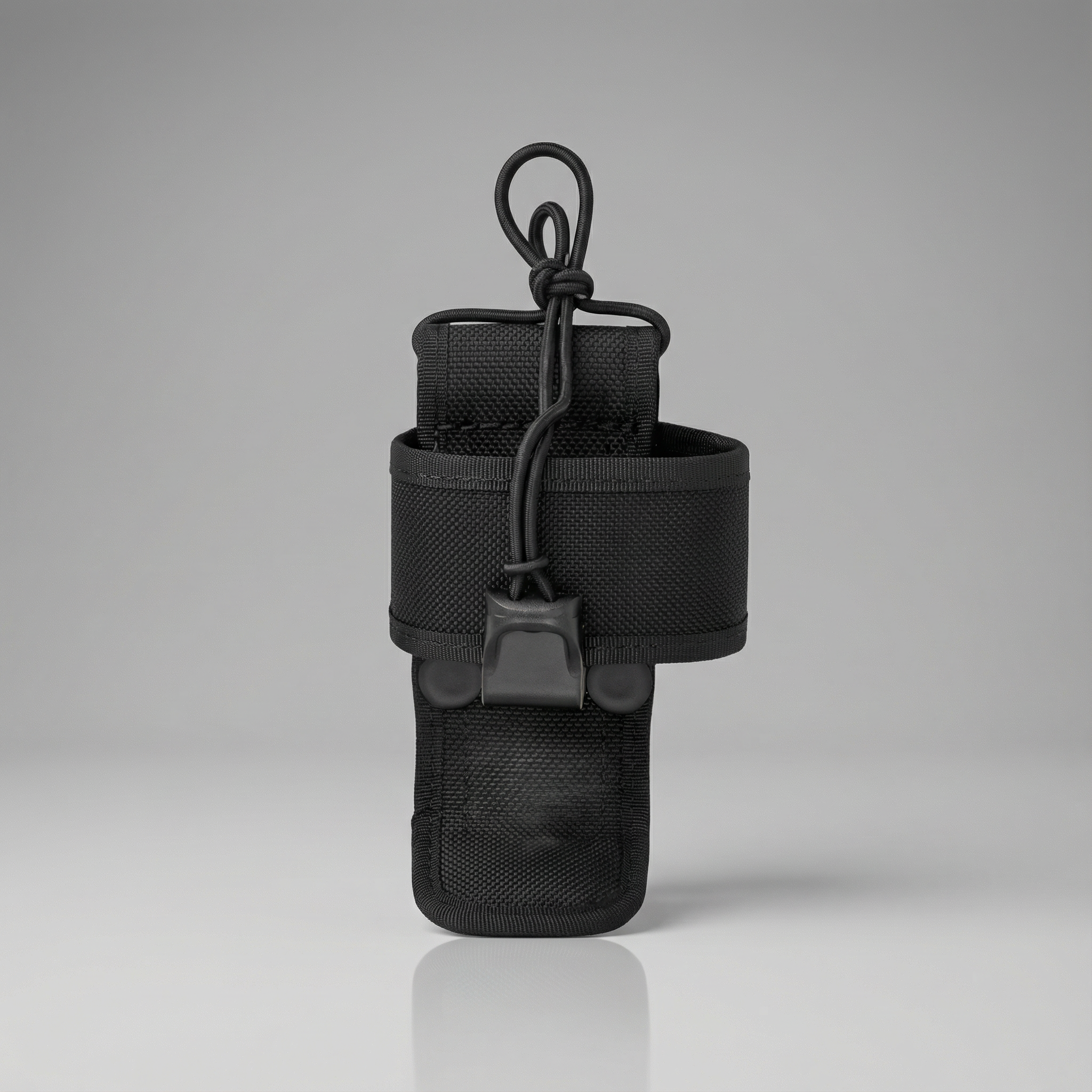 Black tactical pouch with a hook on a gray background