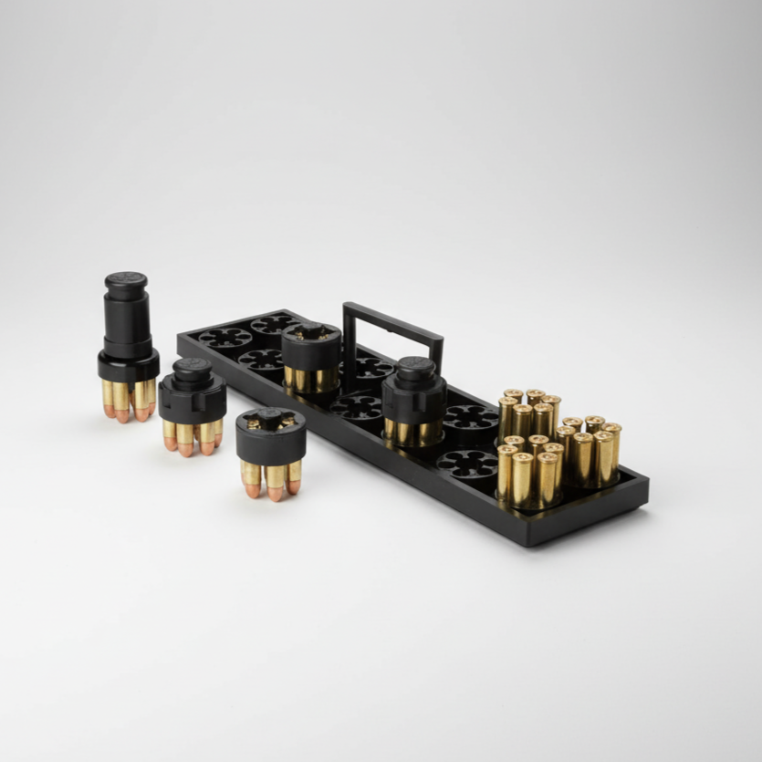 Black ammunition holder with brass bullets on a gray background