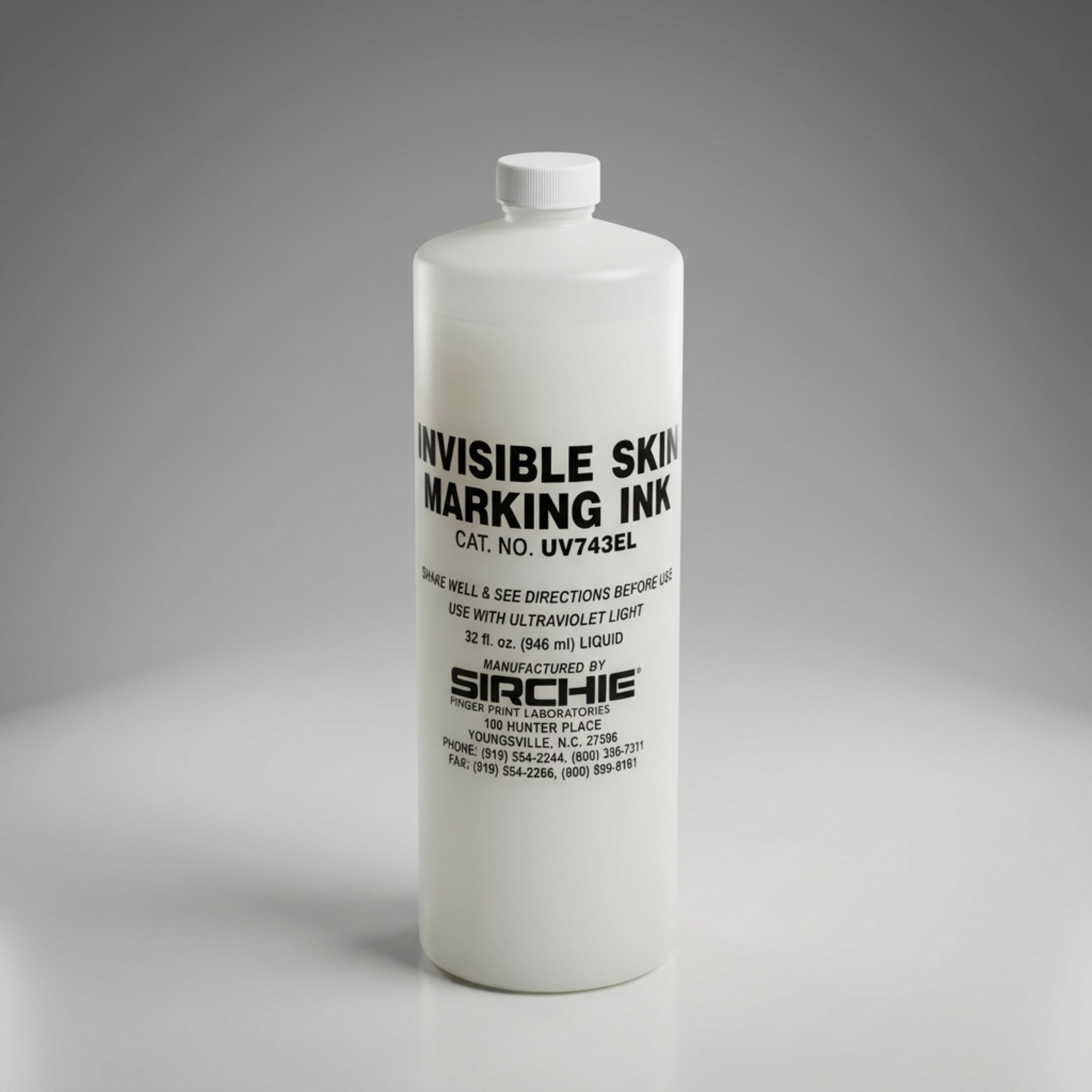 Bottle of SIRCHIE invisible skin marking ink on a gray background